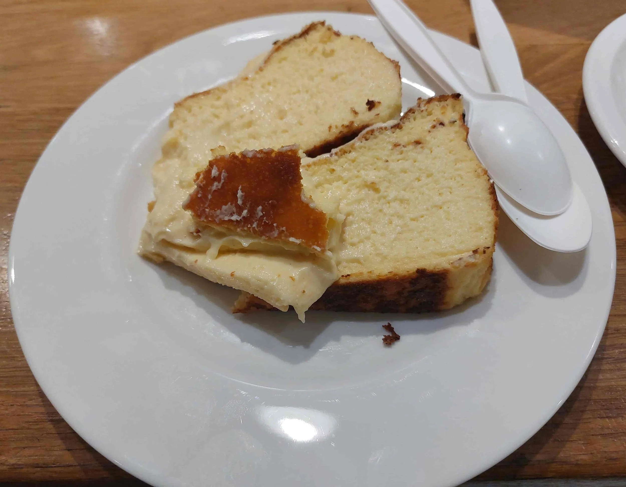 Two slices of Basque cheesecake