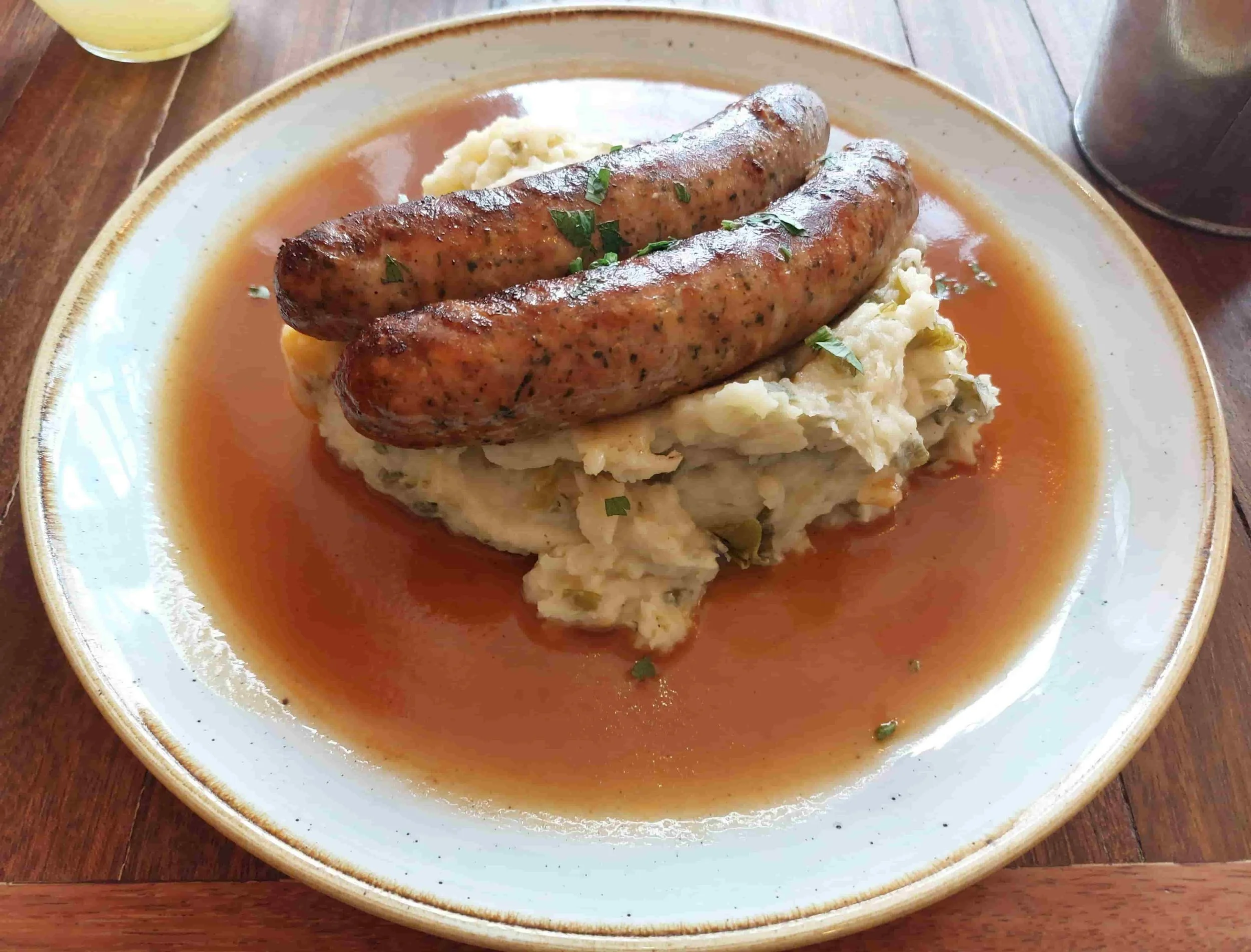Belgian Stoemp-Saucisse vegetable and potato mash with sausage and rich gravy