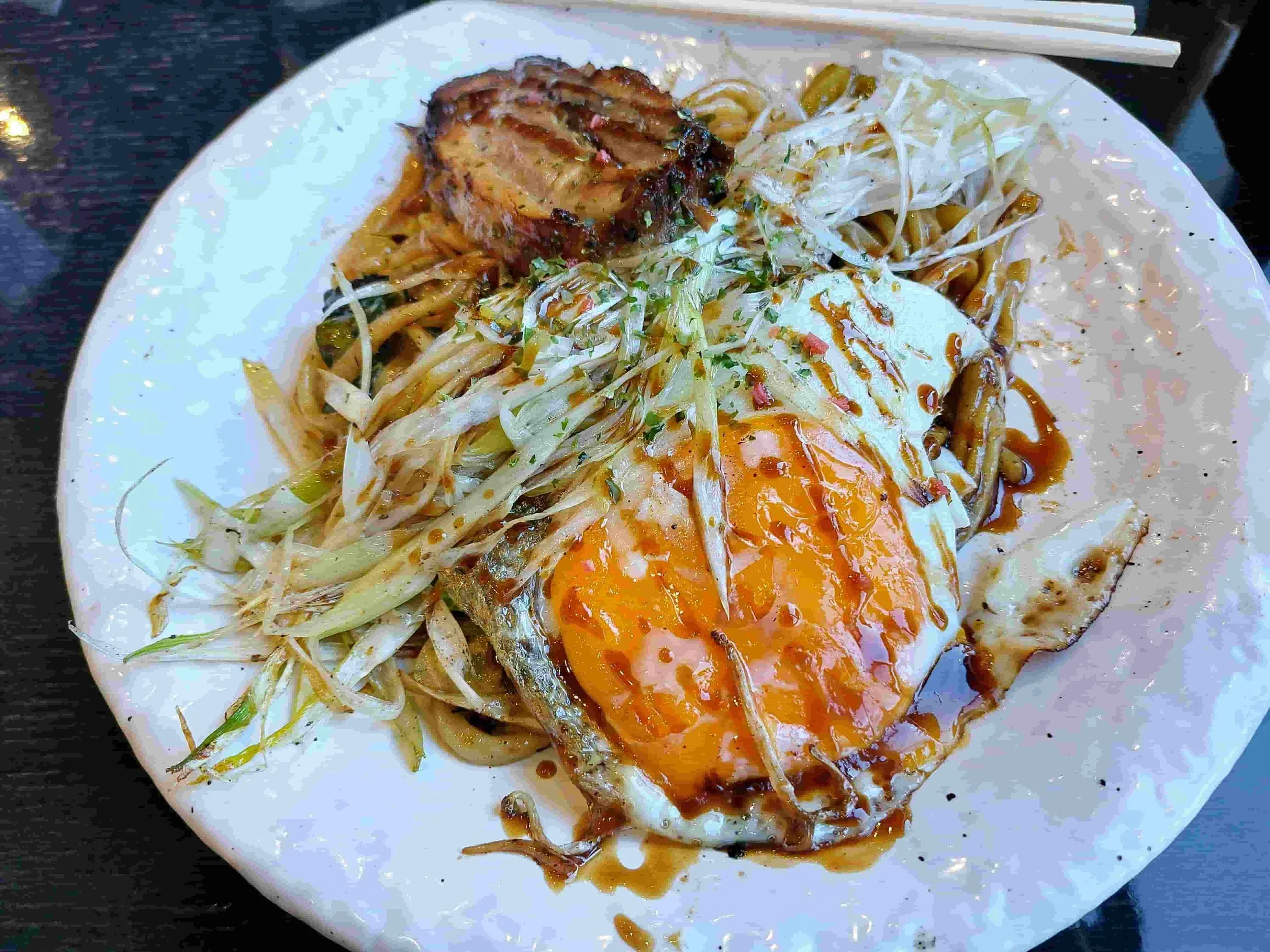 Japanese yakisoba – stir-fried noodles with vegetables, sliced pork, egg, and savory sauce