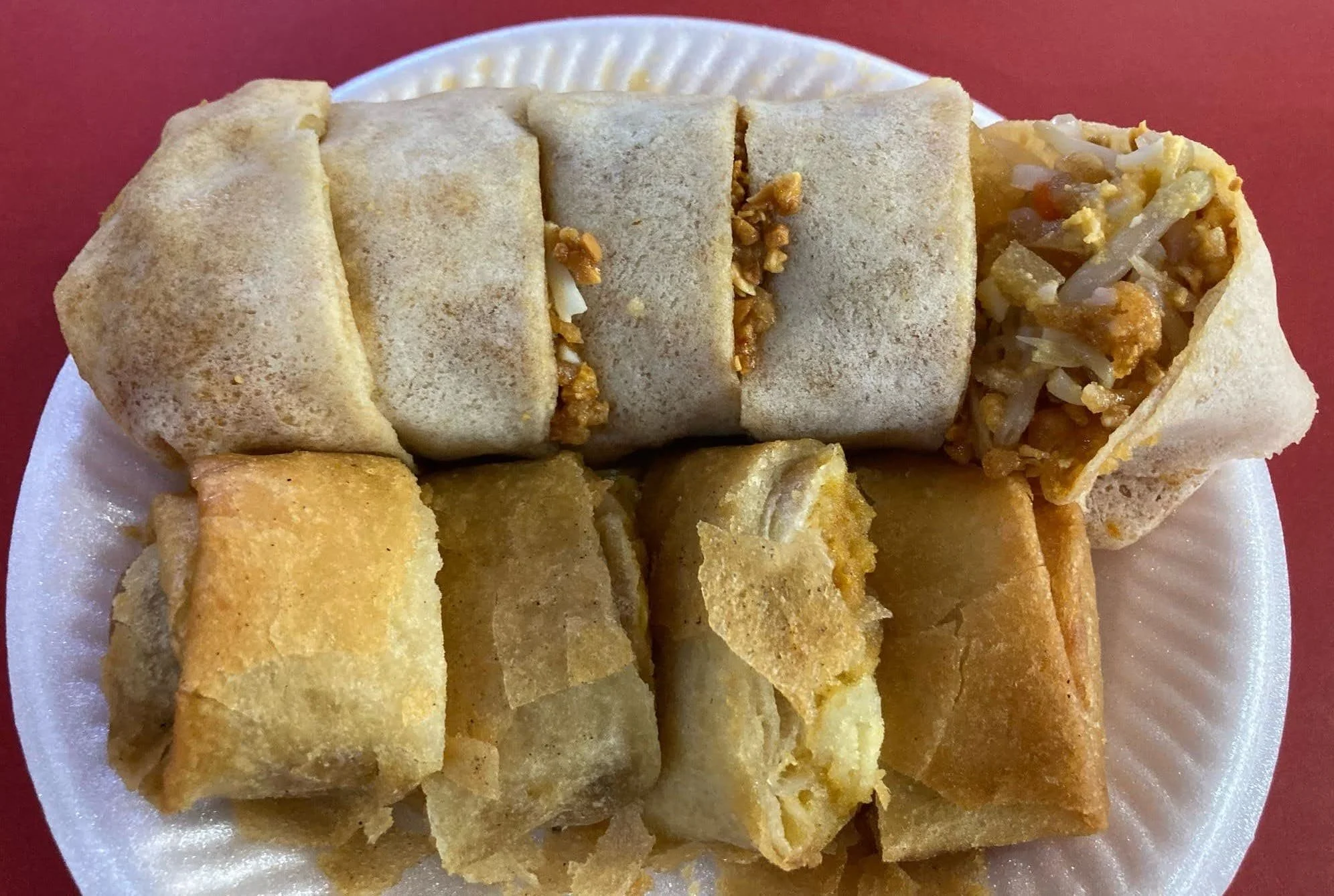 Fried popiah Malaysian spring roll filled with vegetables and shrimp, served crispy