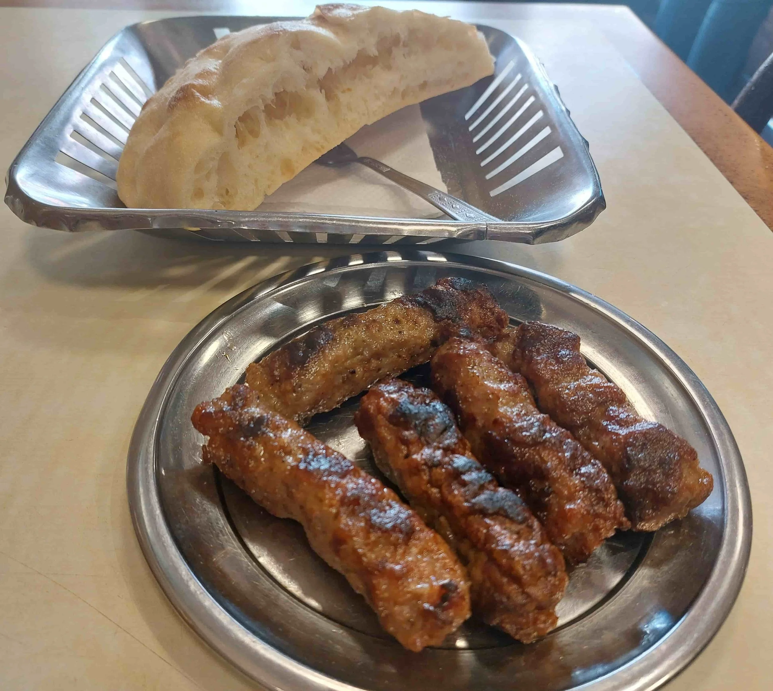 North Macedonian kebapi grilled minced meat sausages served with flatbread