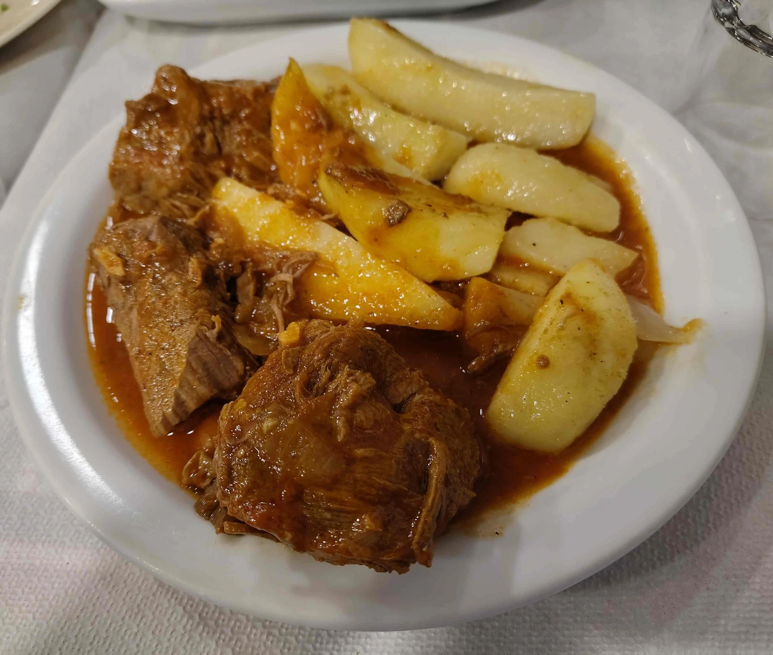 Kokkinisto – Greek slow-cooked meat stew in tomato sauce with potatoes