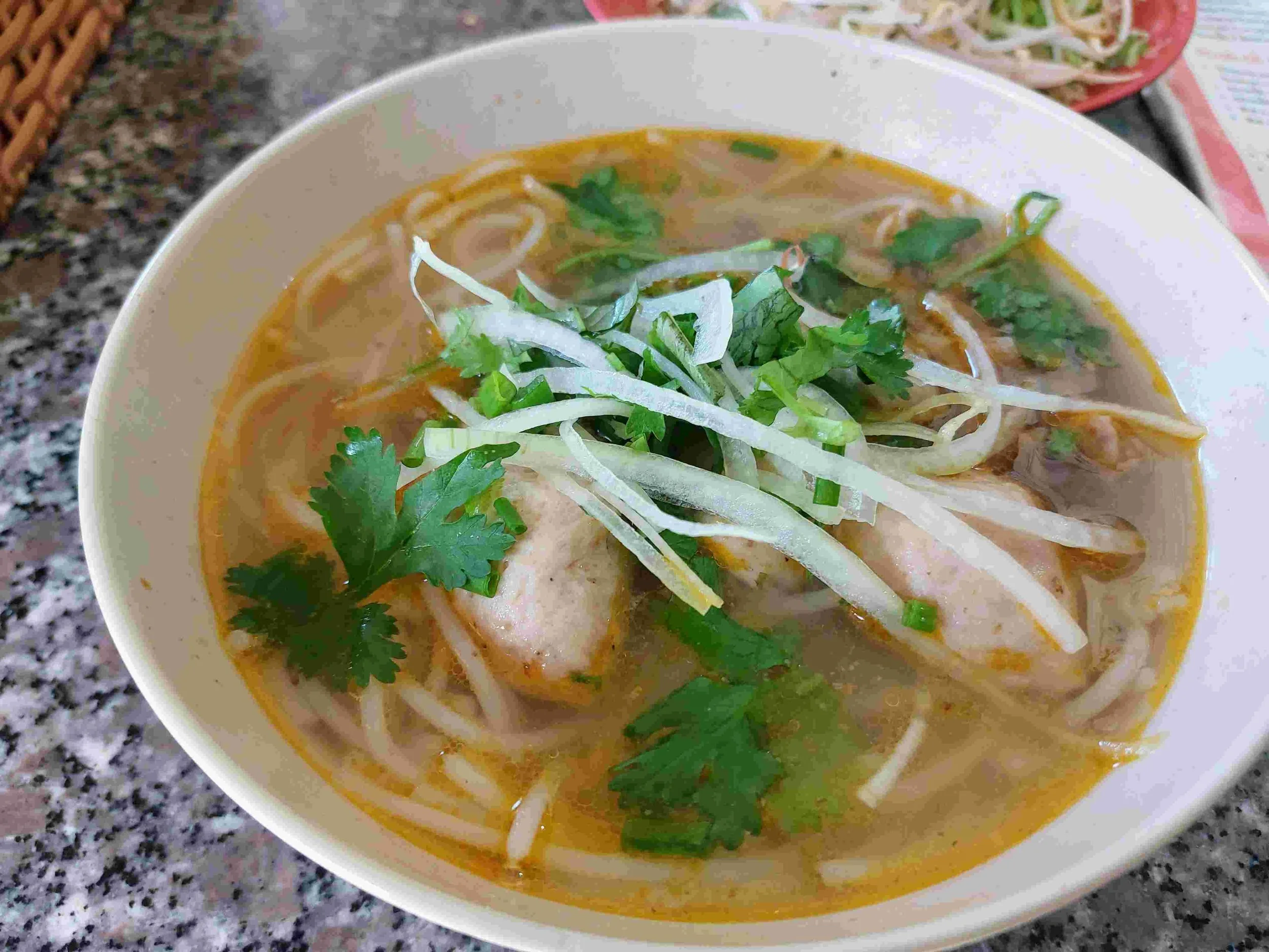 Bún Mọc – Vietnamese pork meatball noodle soup with clear broth, rice noodles, and fresh herbs