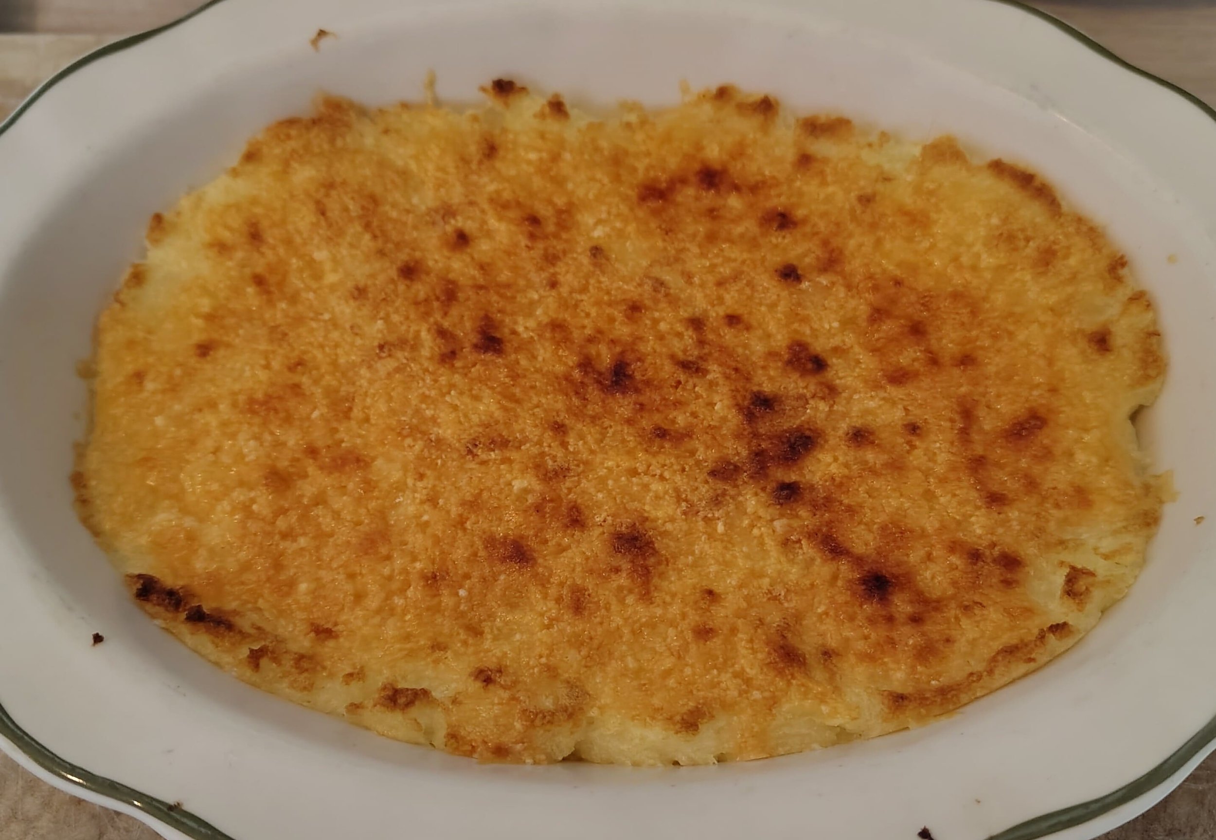 Traditional Brazilian escondidinho, a baked dish of mashed cassava layered with seasoned meat