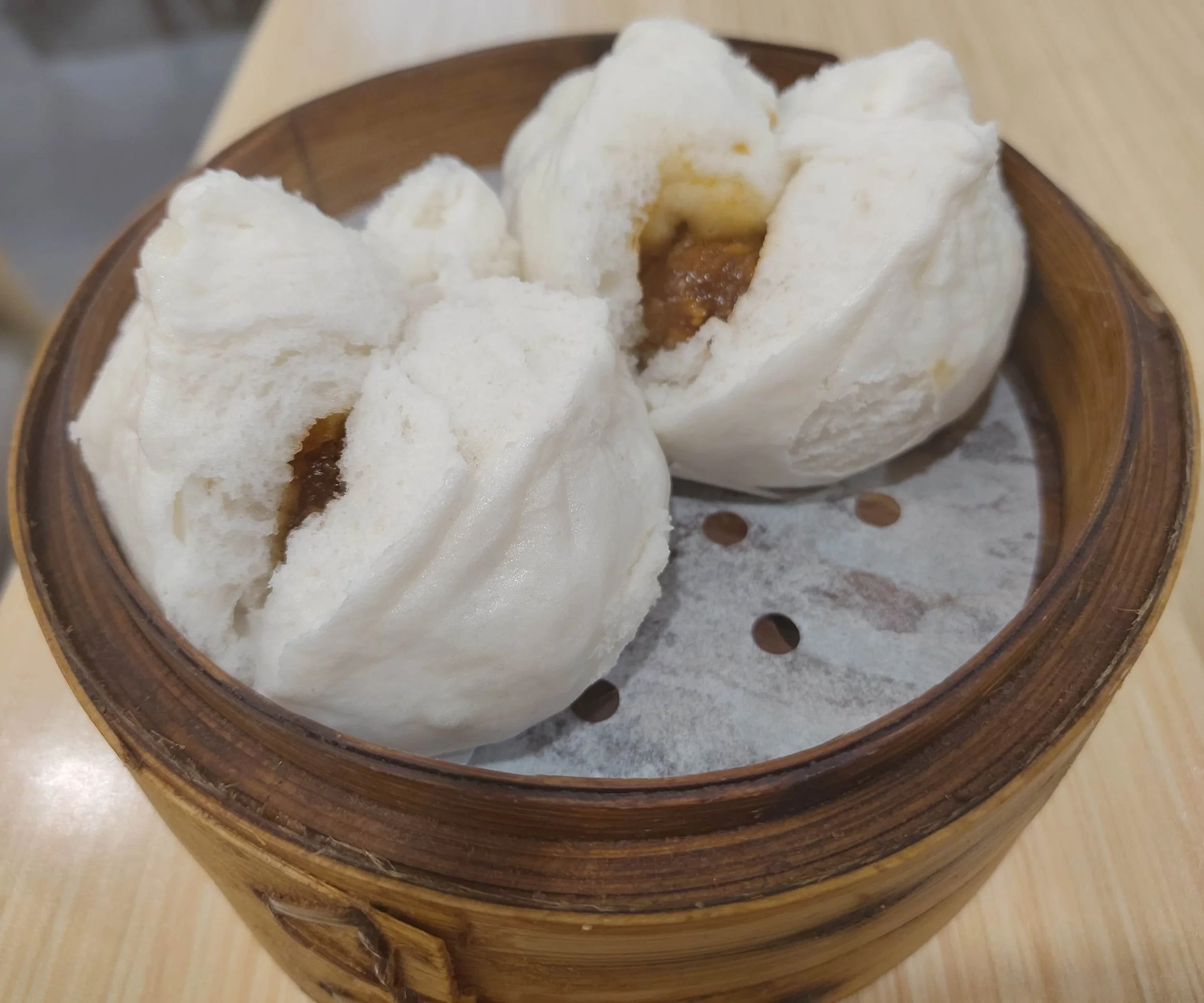 Two Hong Kong char siu bao – steamed buns filled with sweet barbecued pork