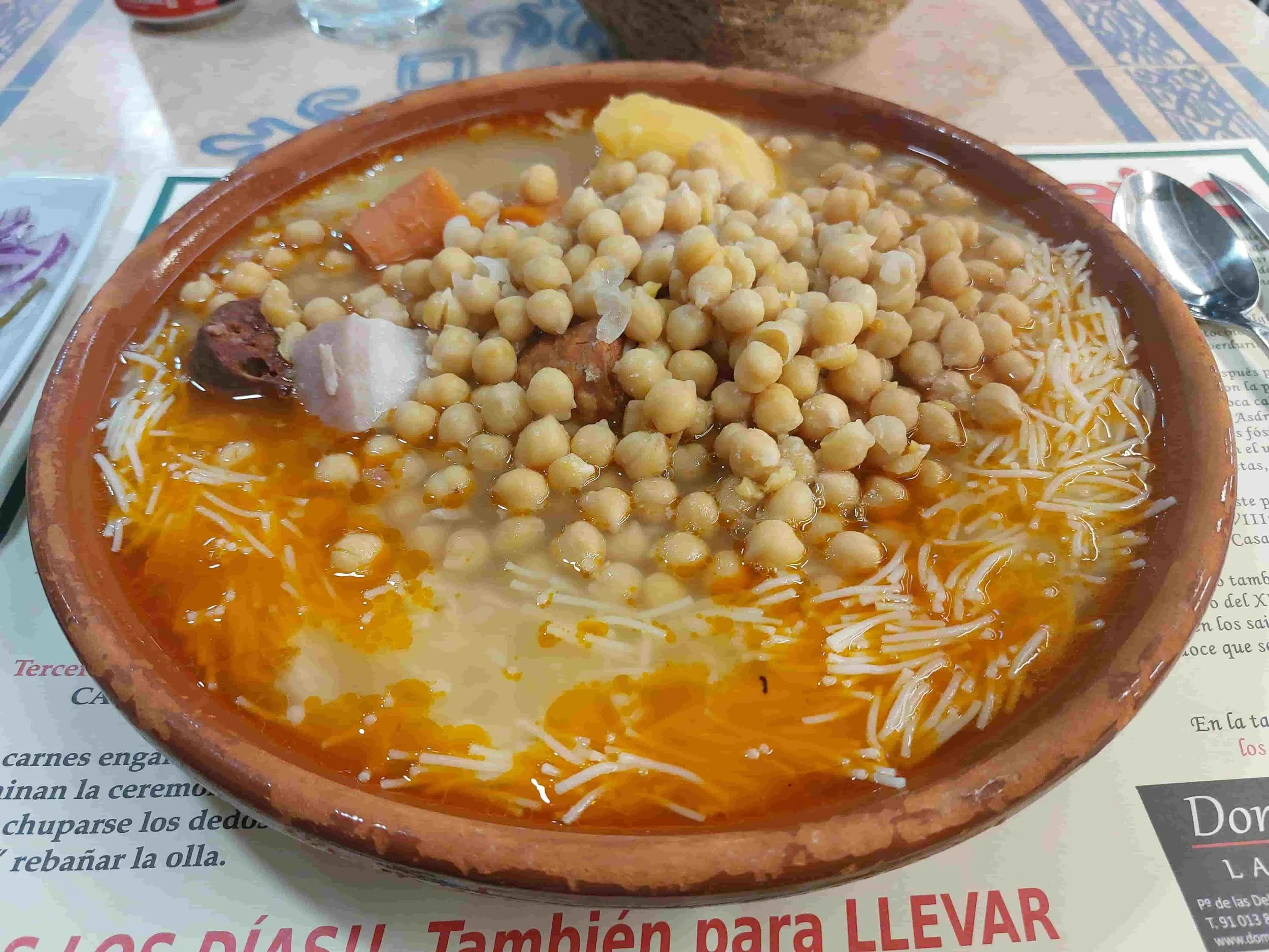 Spanish Cocido Madrileño traditional chickpea stew with meats and vegetables