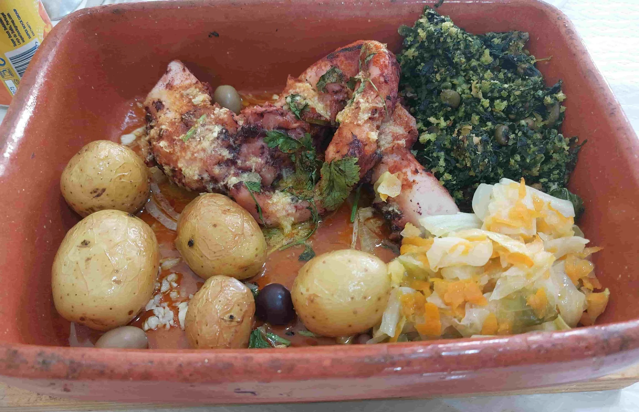 Portuguese Polvo à Lagareiro roasted octopus with potatoes, garlic, and olive oil