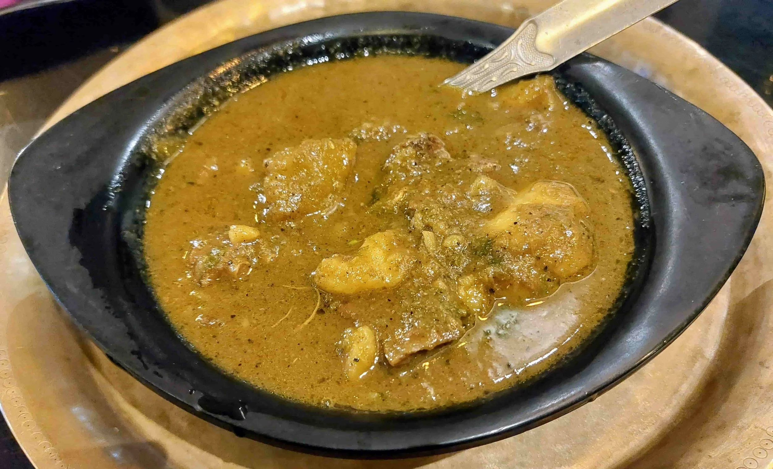 Kumurat diya hanhor mangxo – traditional Assamese duck meat curry cooked with ash gourd