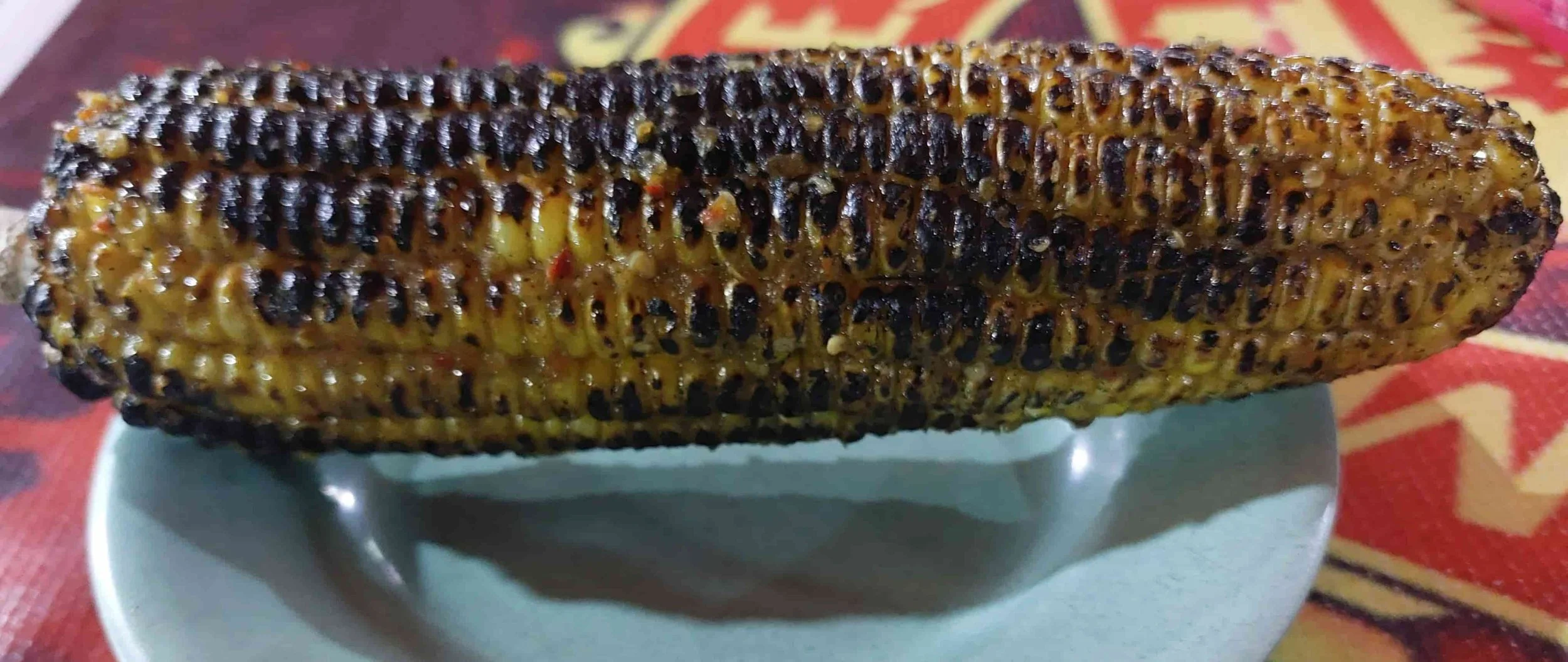 Jagung Bakar –charred grilled corn on the cob with spicy seasoning and butter