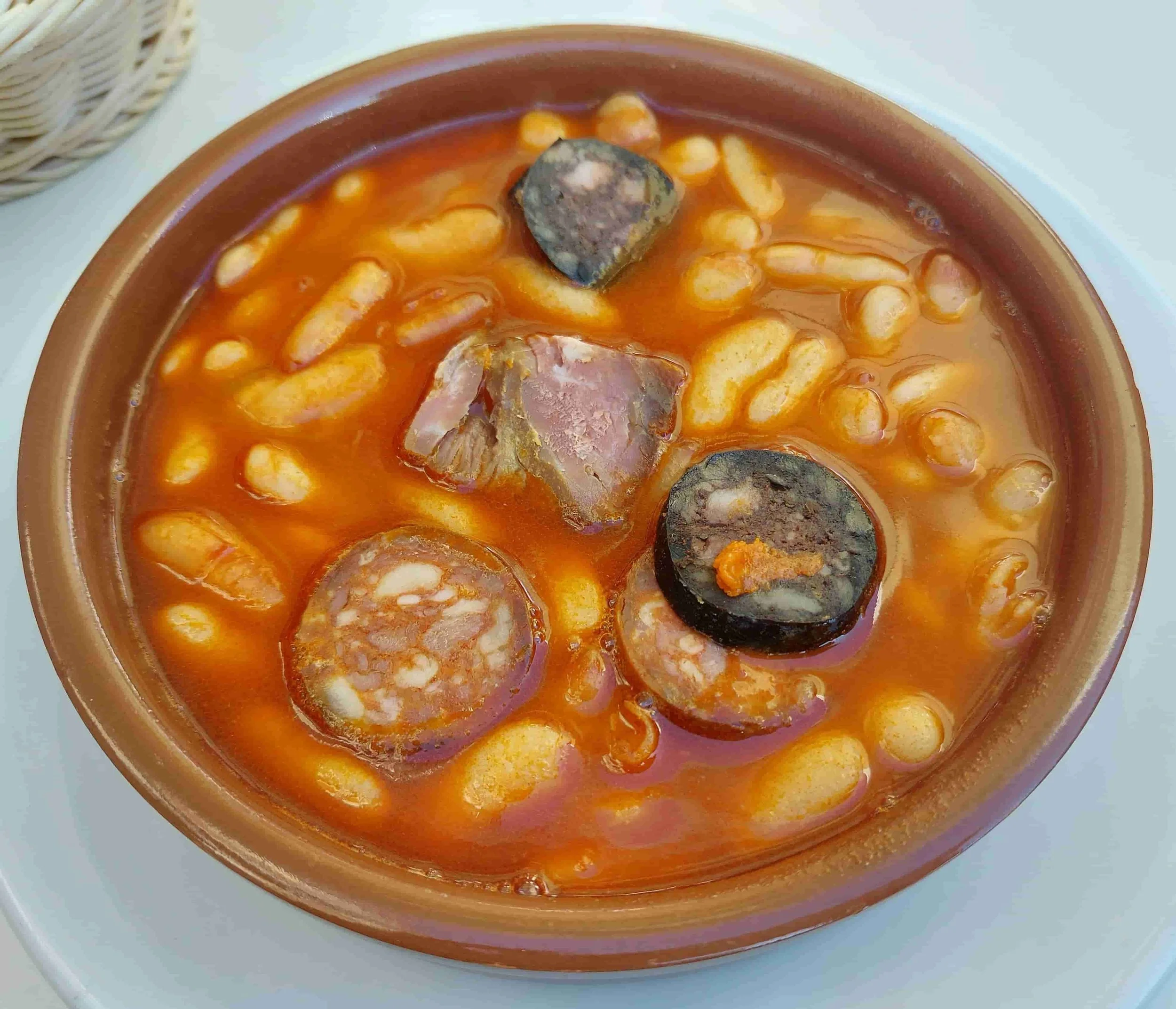 Spanish Fabada Asturiana bean stew with chorizo, morcilla, and pork