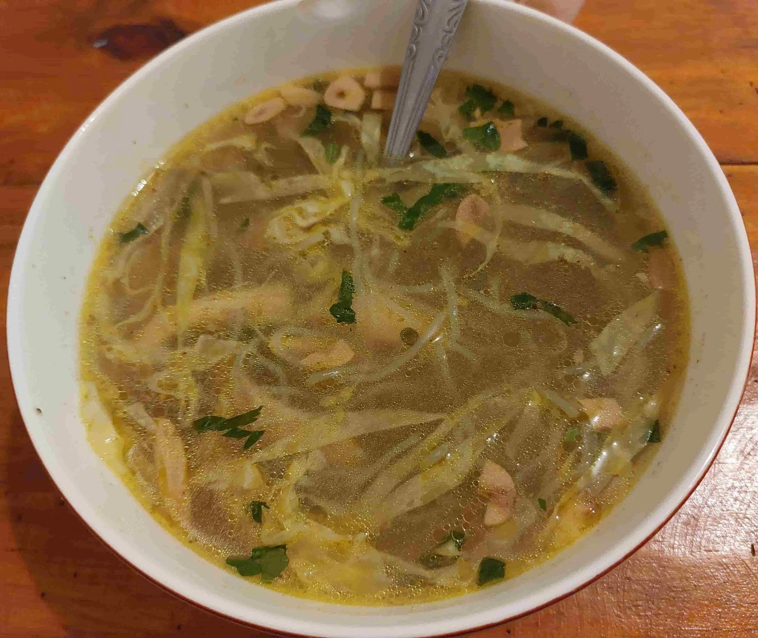 Soto ayam – Indonesian turmeric chicken soup with shredded chicken, vermicelli noodles