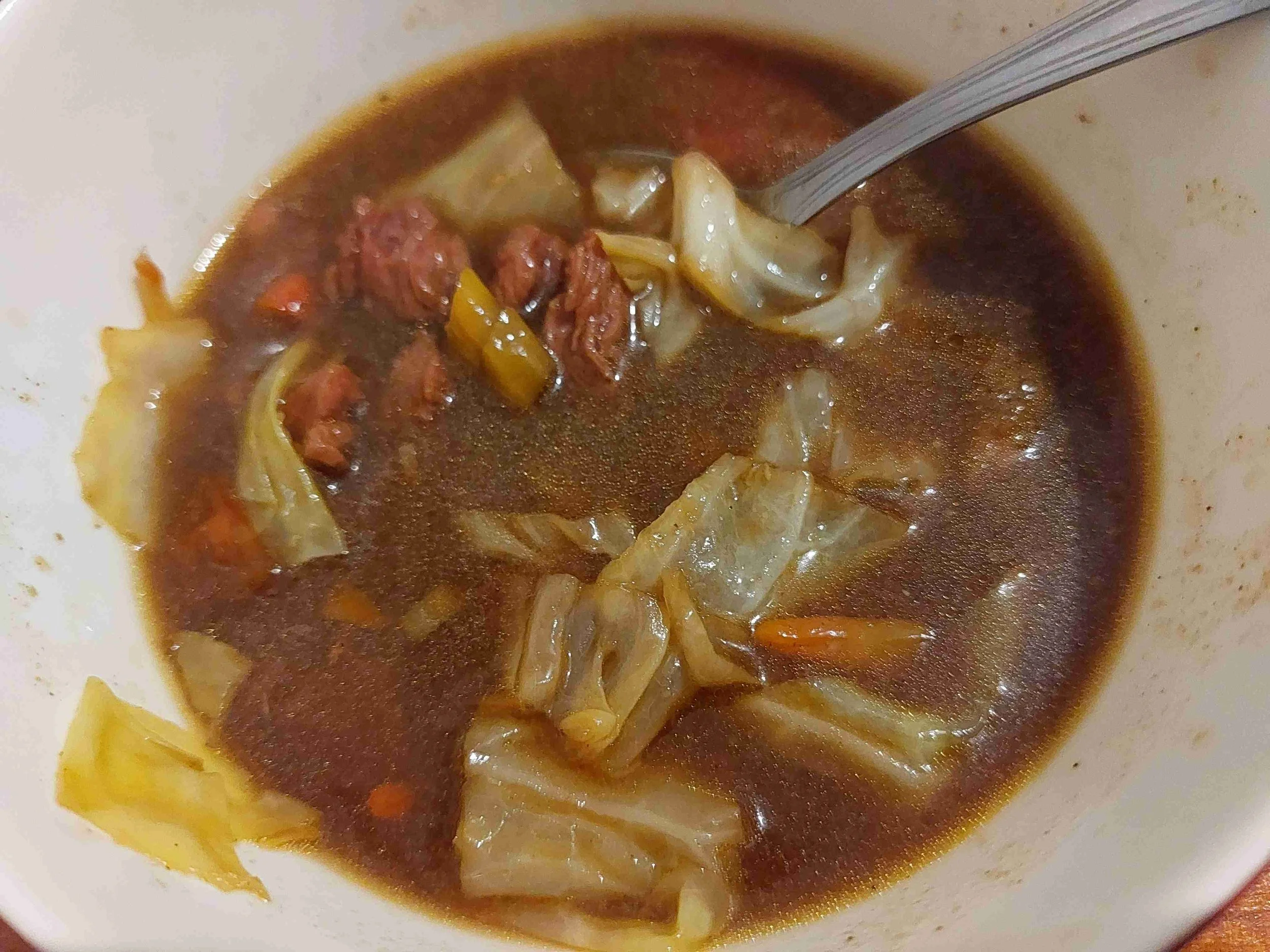 Central Javanese beef curry with cabbage, tomatoes, and sweet soy sauce in a rich, spiced coconut broth