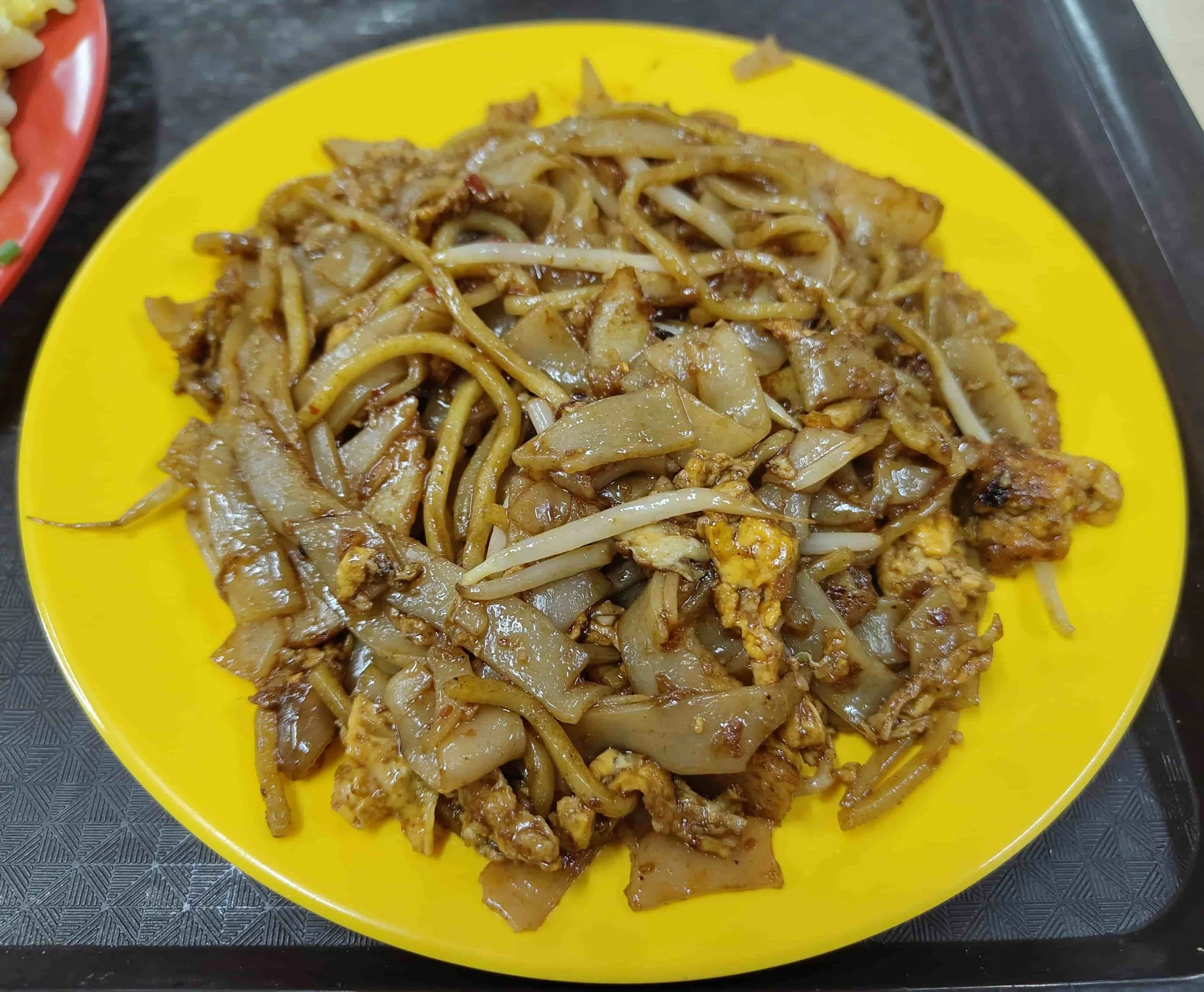 Char kway teow – Singapore stir-fried flat rice noodles with egg, and bean sprouts
