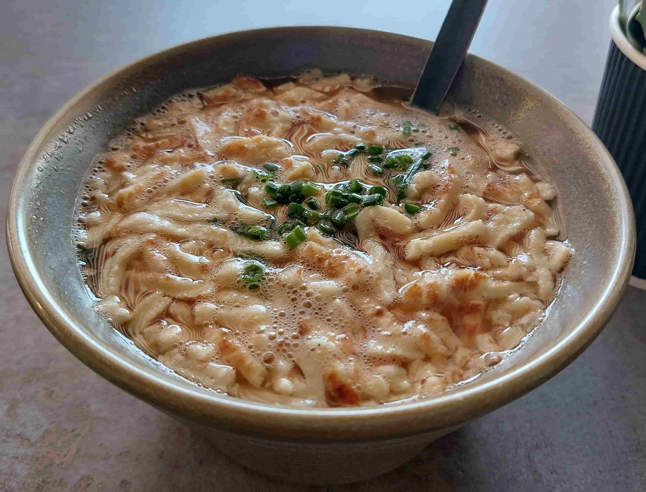 Frittatensuppe clear beef broth with sliced pancake strips traditional soup