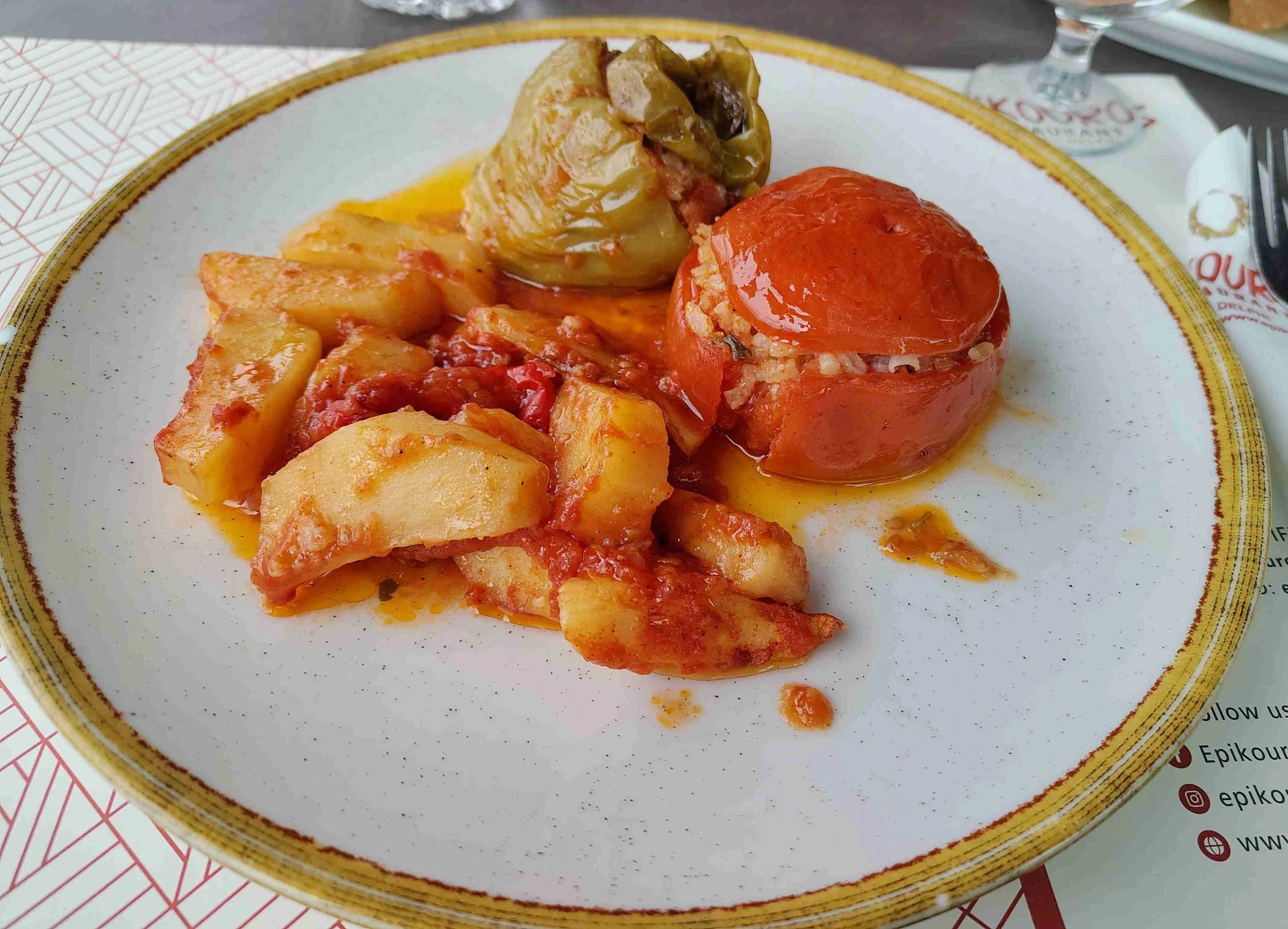 Yemista – Greek stuffed tomatoes and peppers with rice and herbs served with potatoes