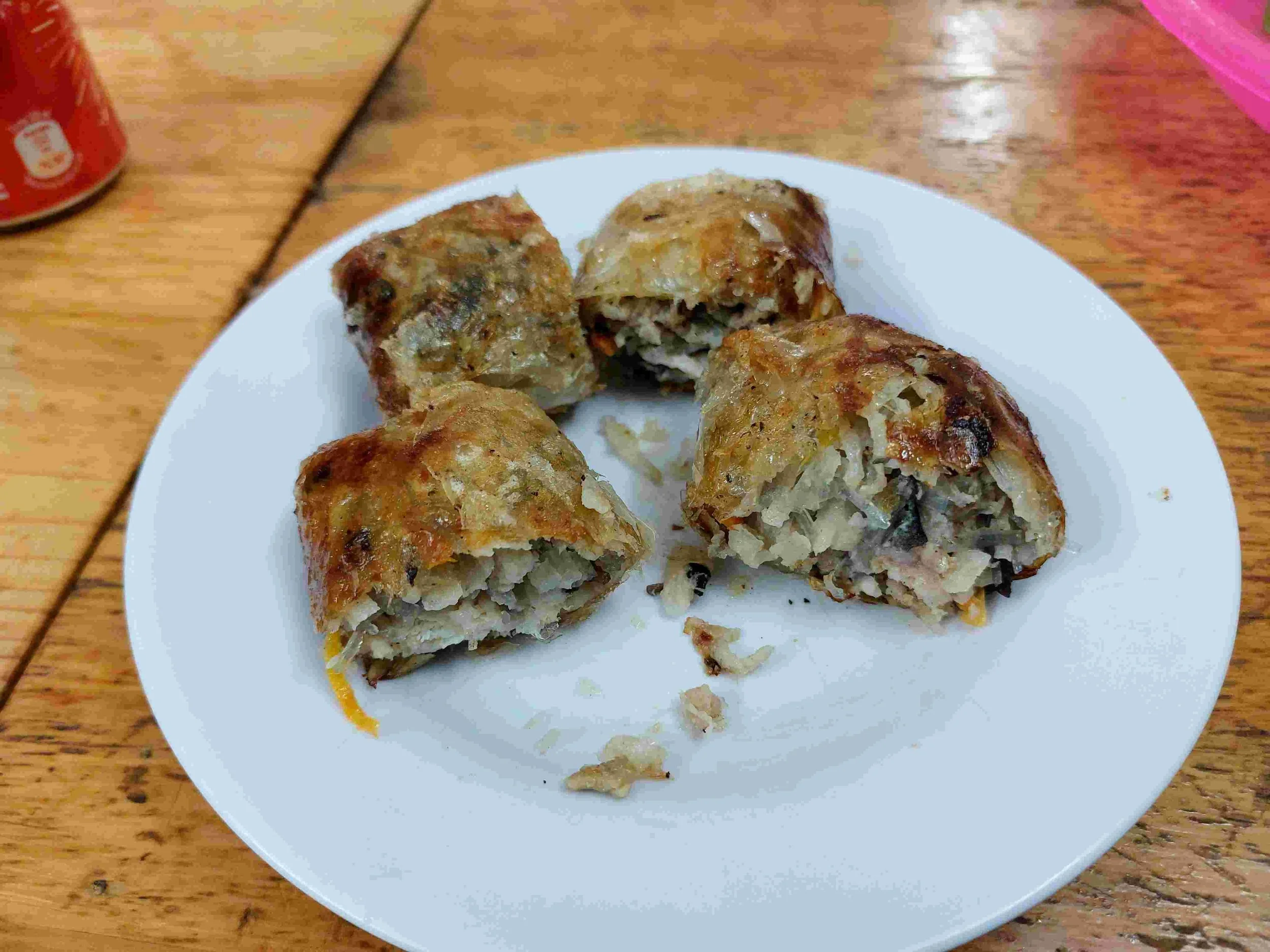 Chả giò – Crispy Vietnamese fried spring rolls filled with minced pork, glass noodles, mushrooms, and vegetables.