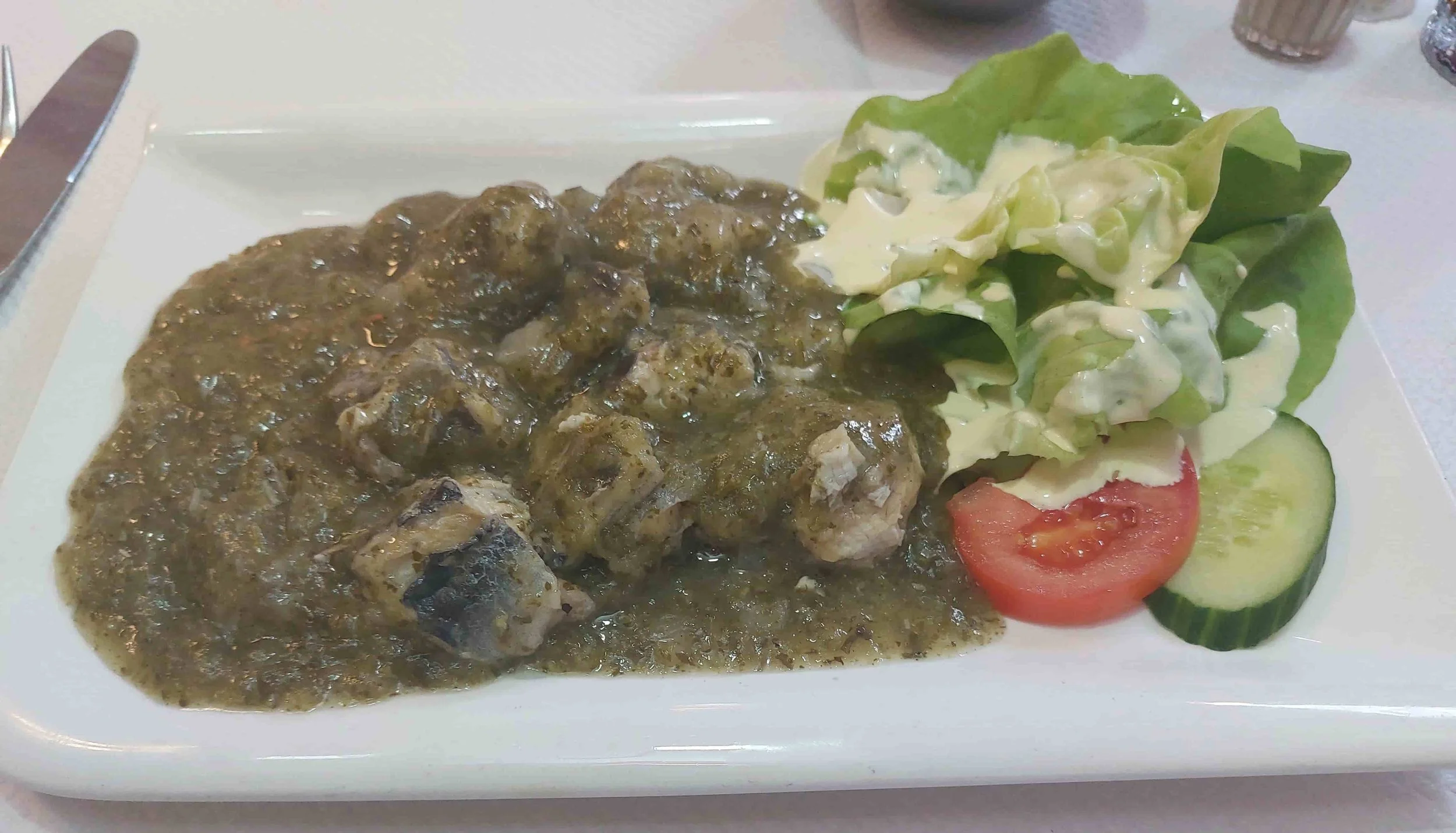 Eel in the green – traditional Belgian eel cooked in a green herb sauce served with salad