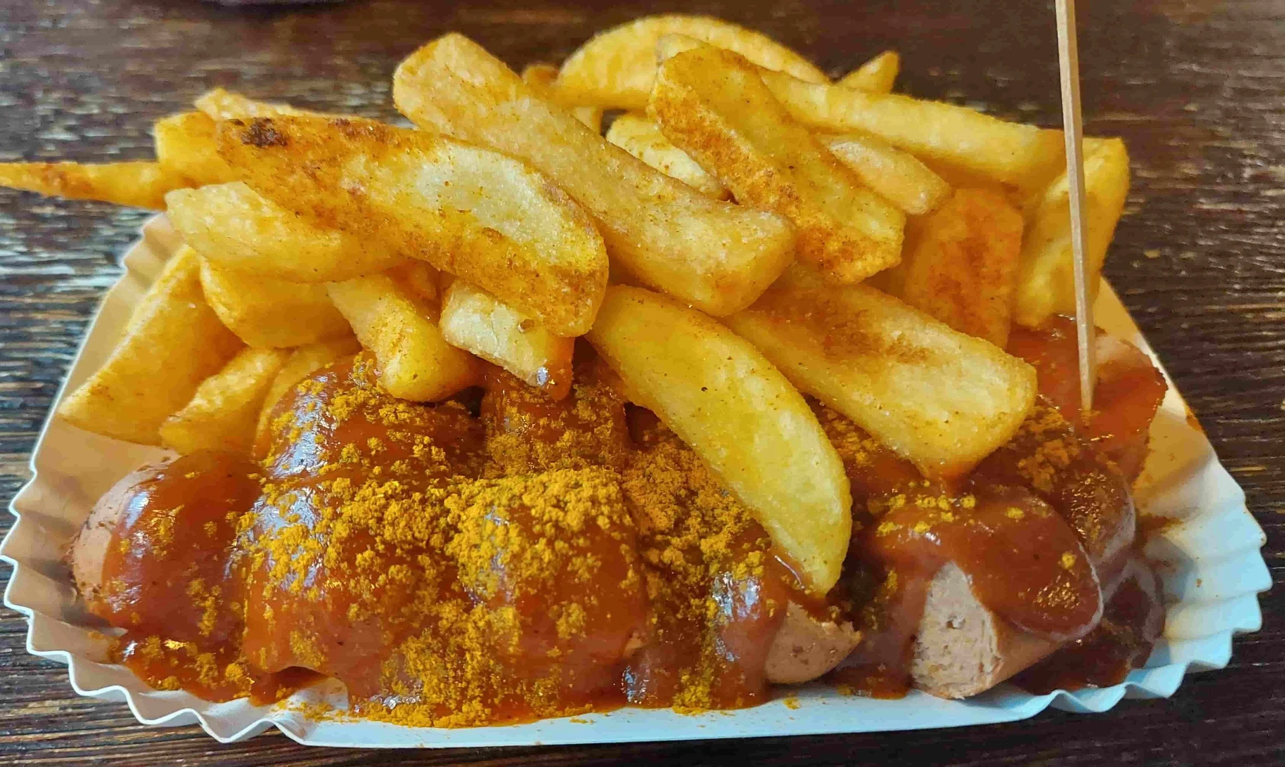German currywurst sausage with curry ketchup and fries
