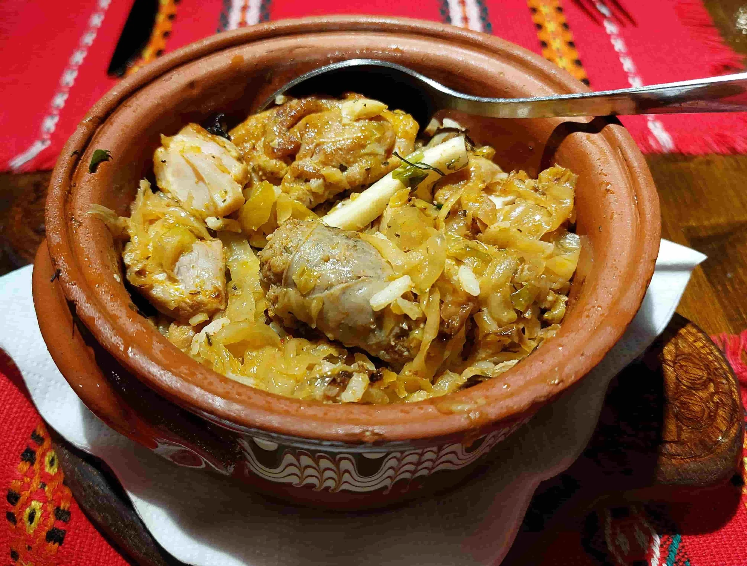 Bulgarian kapama slow-baked meat and sauerkraut stew in clay pot