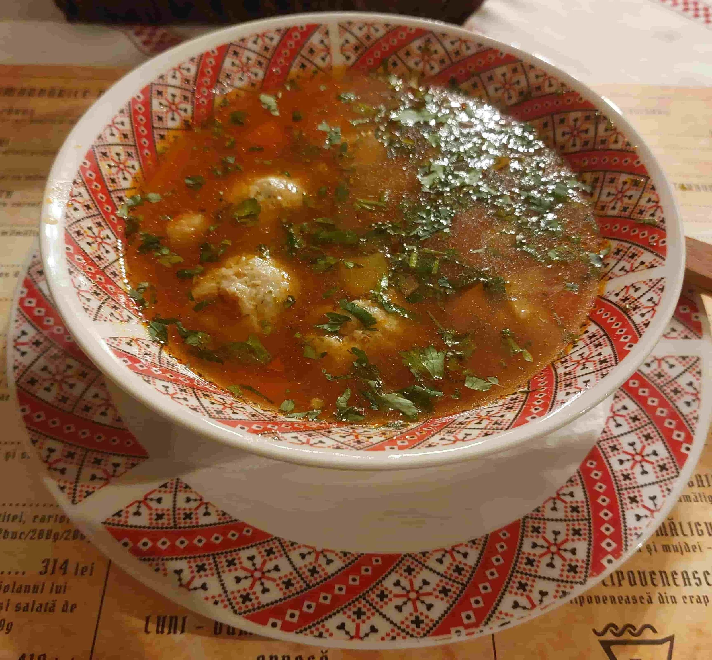 Ciorbă de perișoare Romanian sour soup with meatballs and vegetables
