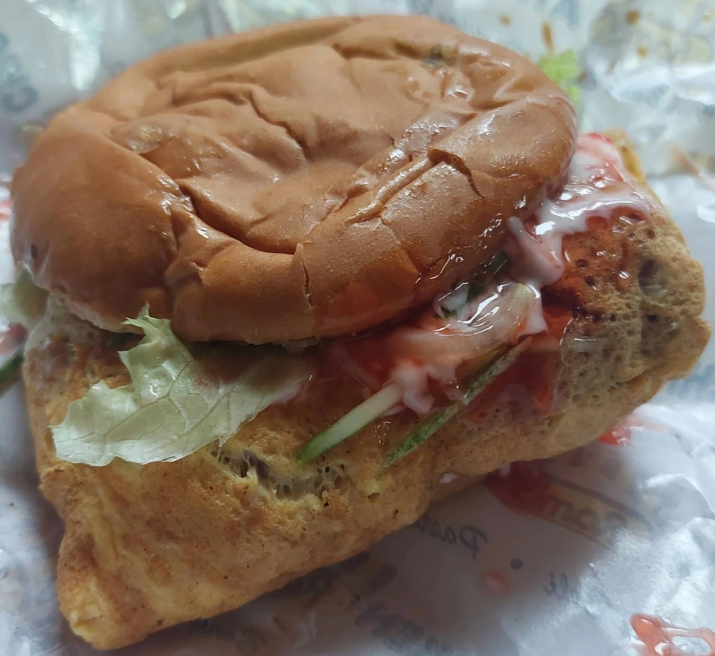 Ramly burger – Malaysian street-style burger wrapped in egg with beef patty and sauces