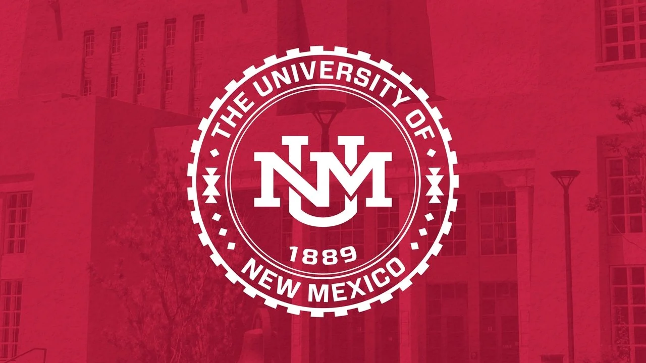 The University of New Mexico seal with "1889" and "UNM" text on a red background.