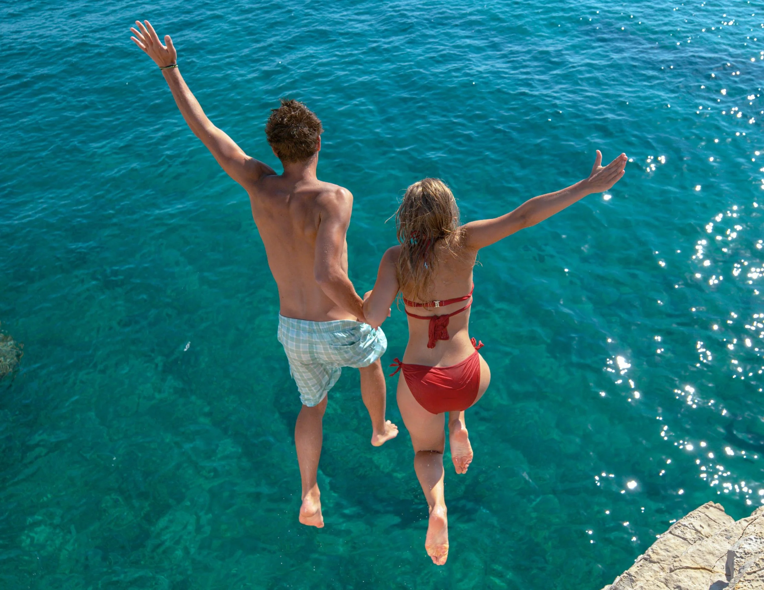 COUPLE JUMPING WATER.jpg