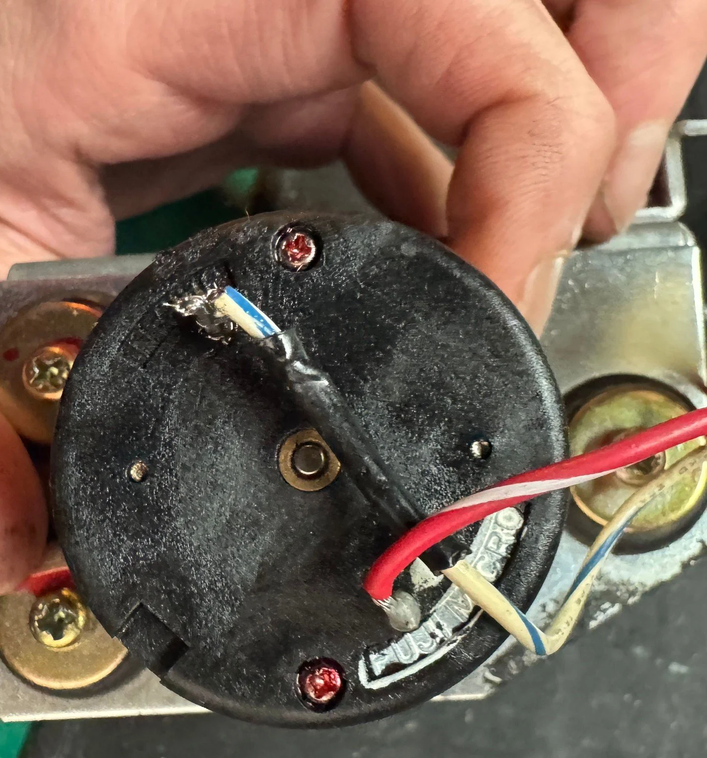 Our fleet manager has been servicing our games in the run-up to Sakura-Con; Super Hang-On started exhibiting some strange behavior. Turns out, its vibration motor was jammed up with......electrolytic capacitors. After replacing the capacitors and cle