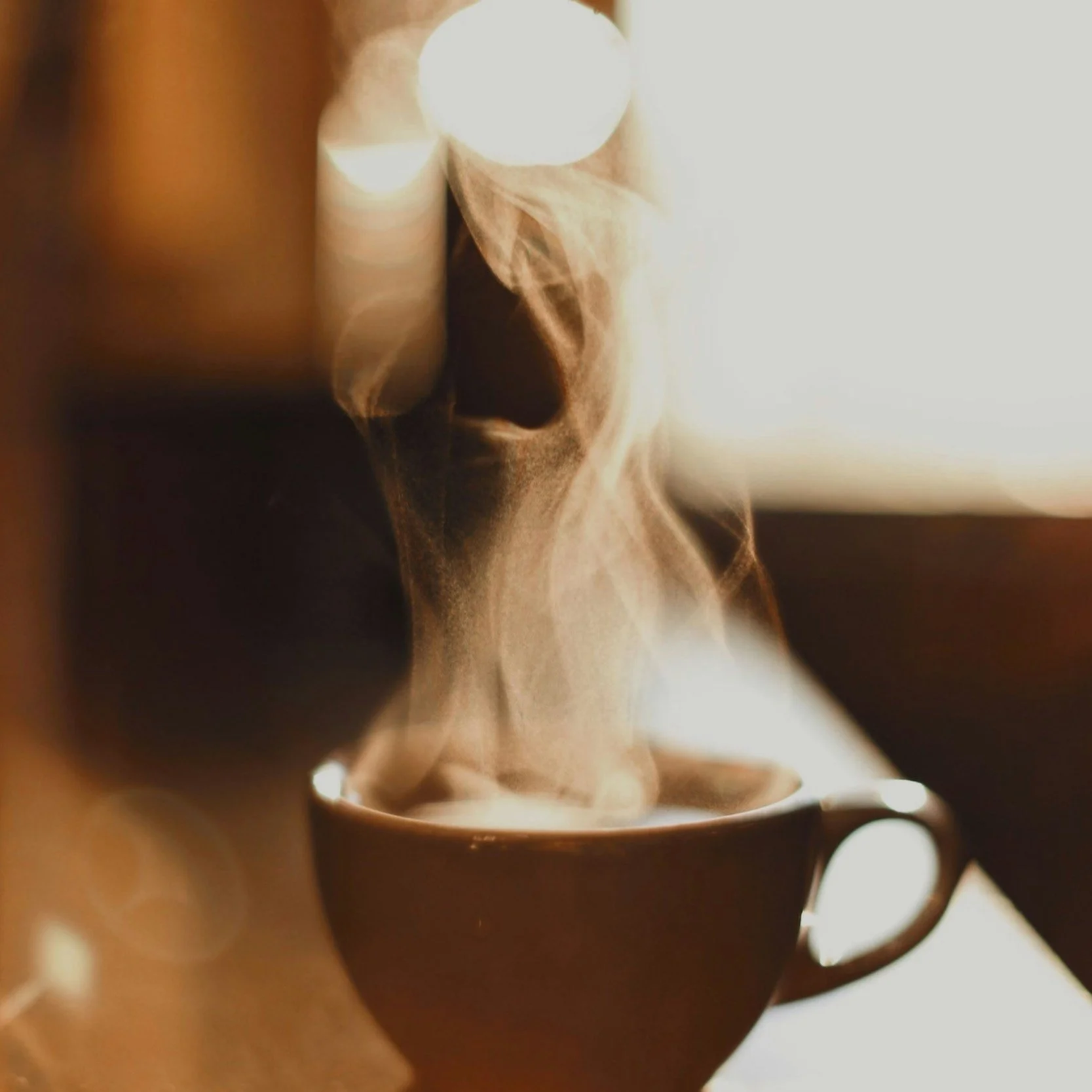 Cup of hot coffee on a table