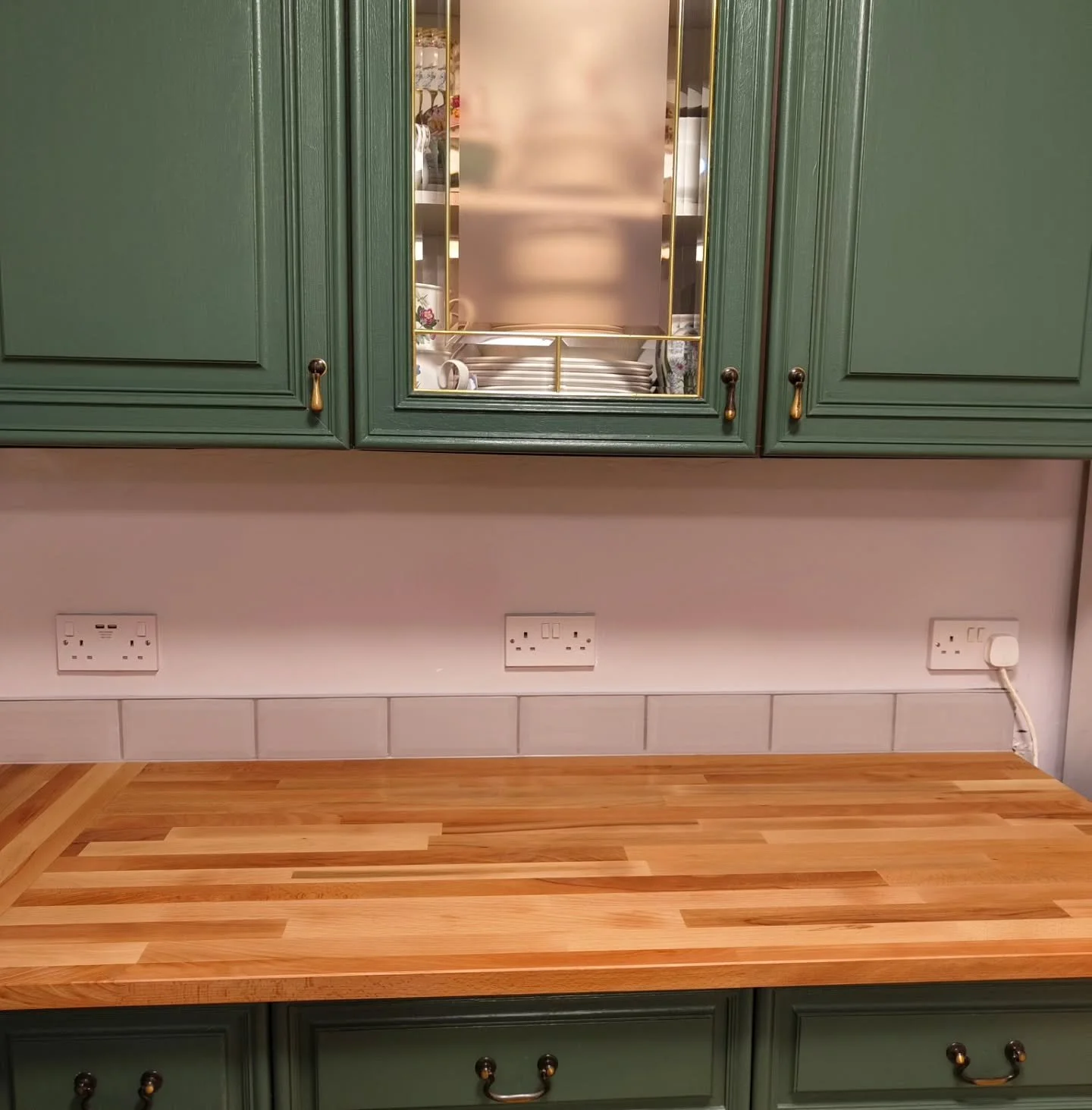 We recently transformed this kitchen with a stunning solid beech worktop.  We also installed a new sink, tap, and added a sleek tile upstand for a polished finish.  What do you think? #kitchenrenovation #beechworktop #sinkinstallation #tileupstand #h