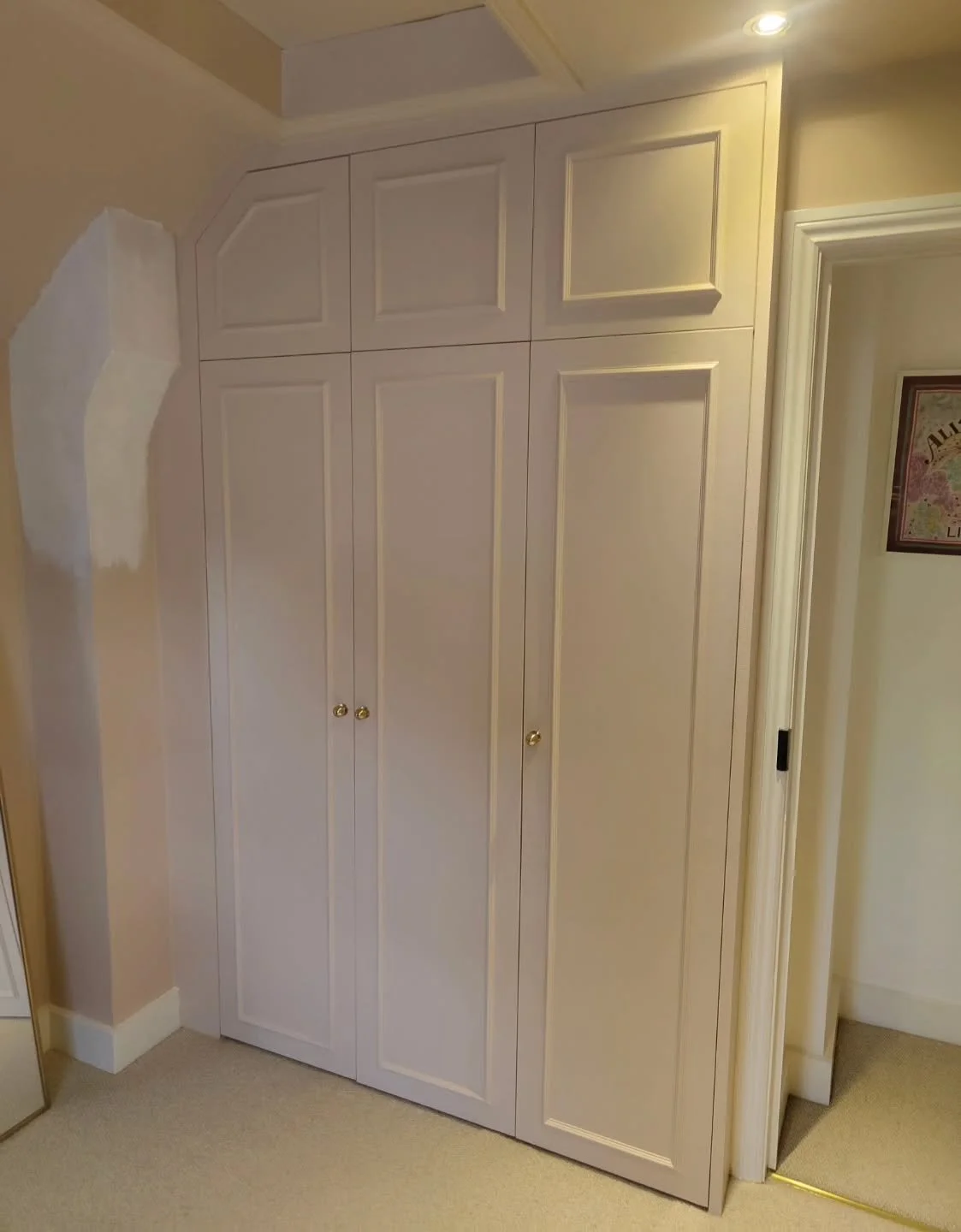 Another custom wardrobe perfectly fitted into a unique space! ✨ Love how this design maximizes storage while blending seamlessly with the room's aesthetic. What do you think of these shaker-style doors?  #customcarpentry #wardrobedesign #fittedfurnit