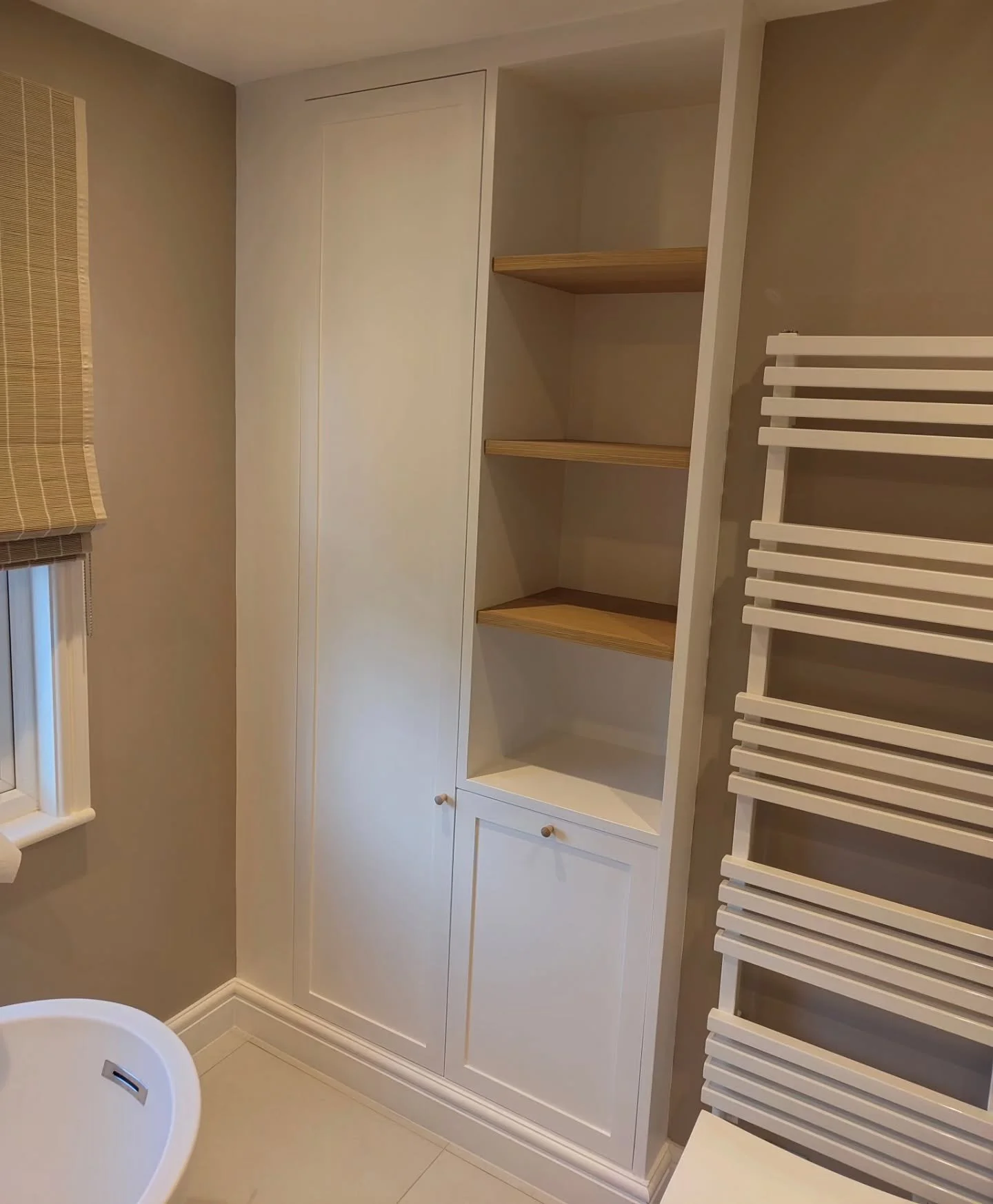 A great mix of shaker cabinetry and oak shelves for this latest project. The tall unit hides the boiler and houses a pull-out laundry basket&mdash;keeping things functional but seamless.
#Woodworking #CarpentryLife #ModernBathroom #OakDetails #Bespok