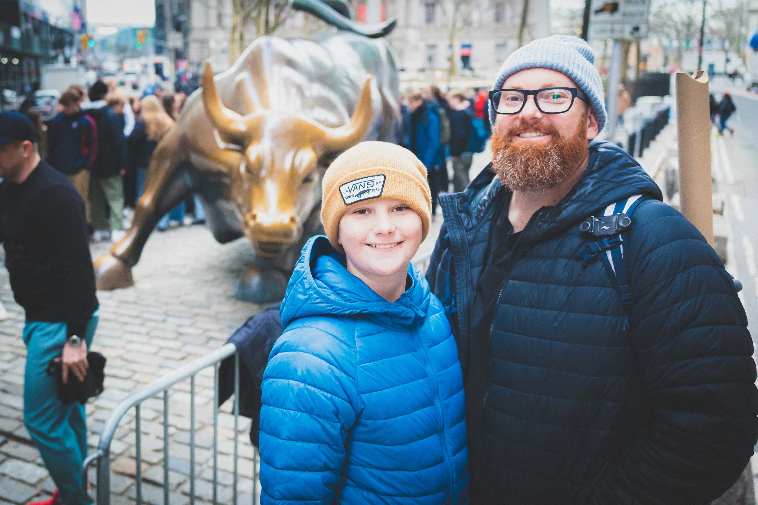 Preston and Wesley of version 55.71 in New York City iwith the Charging Bull near Wall Street in the Financial District.