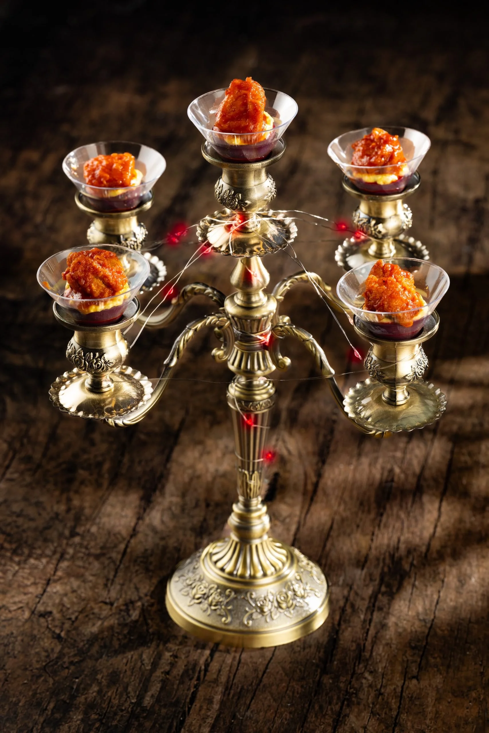 Candelabra Eggs: Deviled eggs with crispy fried chicken, sweet-and-tart pepper sauce, and aji amarillo custard