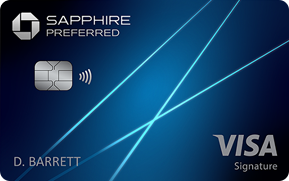 Close-up of a Sapphire Preferred Visa Signature credit card with the name D. Barrett on a blue background showing card details and design.