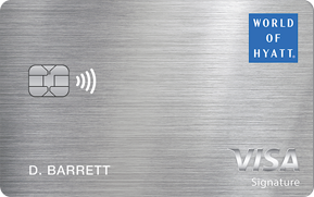 Close-up of a Hyatt World of Hyatt Visa Signature credit card with the cardholder name D. Barrett on a metal surface.