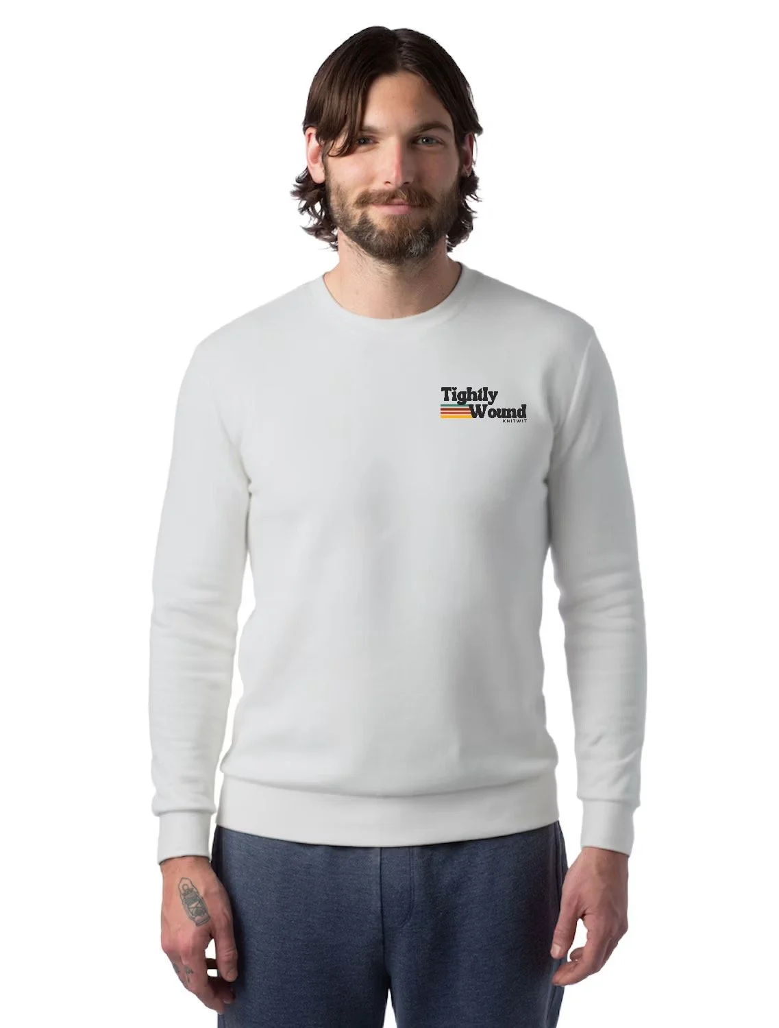 Man wearing a light grey colored Tightly Wound Knitwit crew neck with a small logo on the front chest featuring retro stripes.