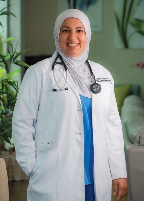 Dr. Uzma Kewan, smiling, in a white coat with a stethoscope