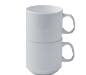 Three white ceramic mugs stacked on top of each other, with the top mug slightly rotated.
