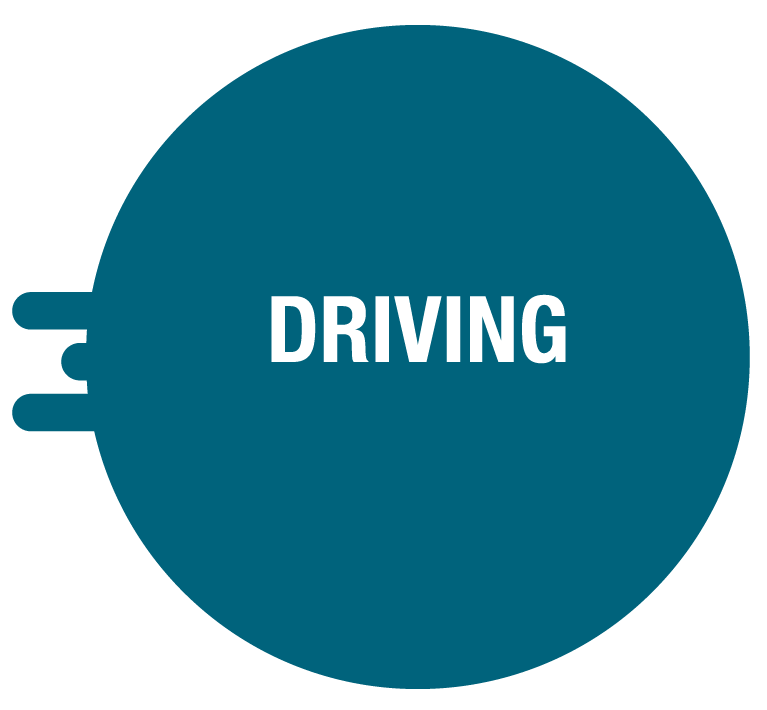 A round blue sign with the word "DRIVING" in white capital letters, indicating a driving-related message or road safety notice.
