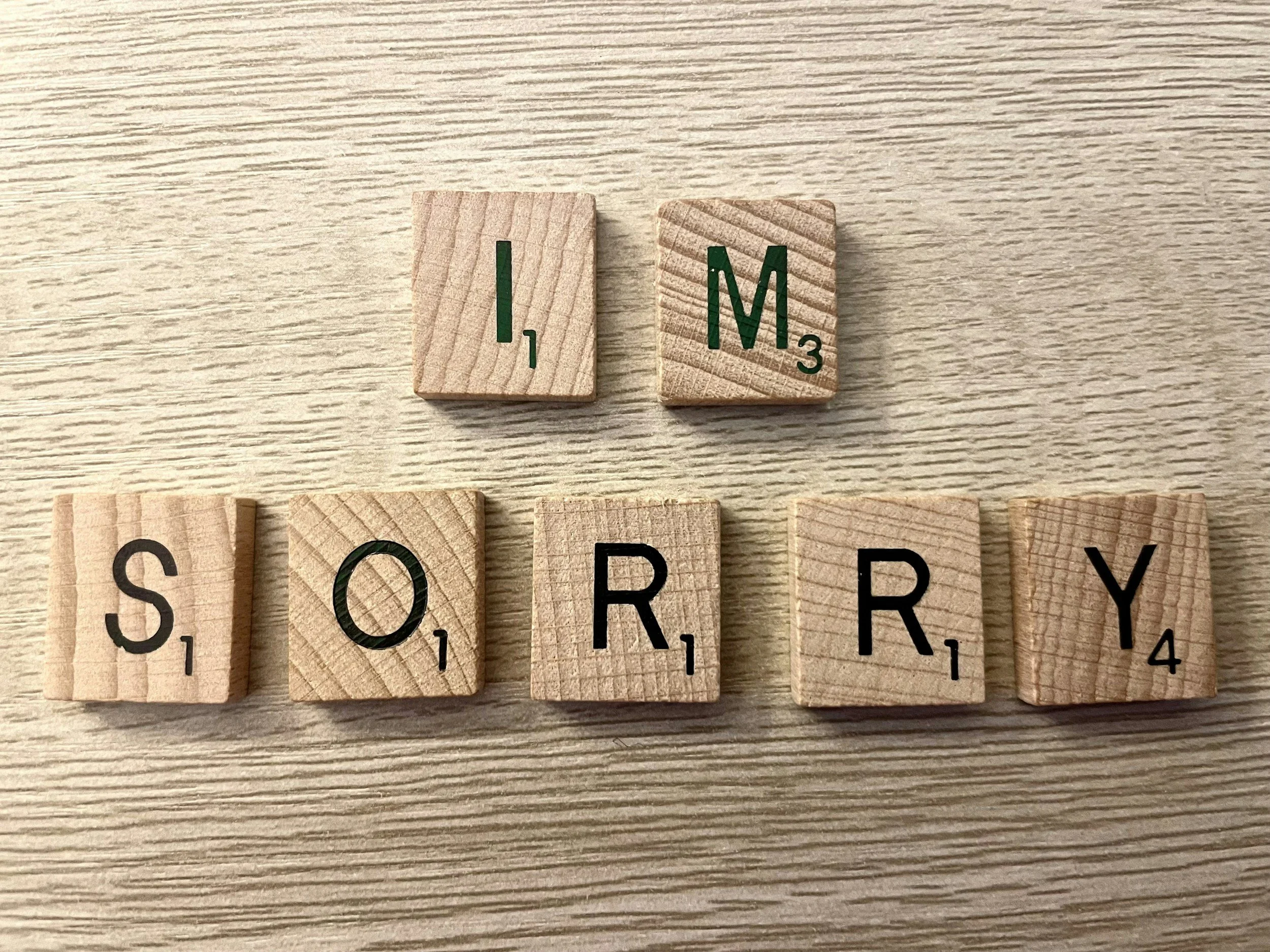 Scrabble tiles that say "I'm sorry"