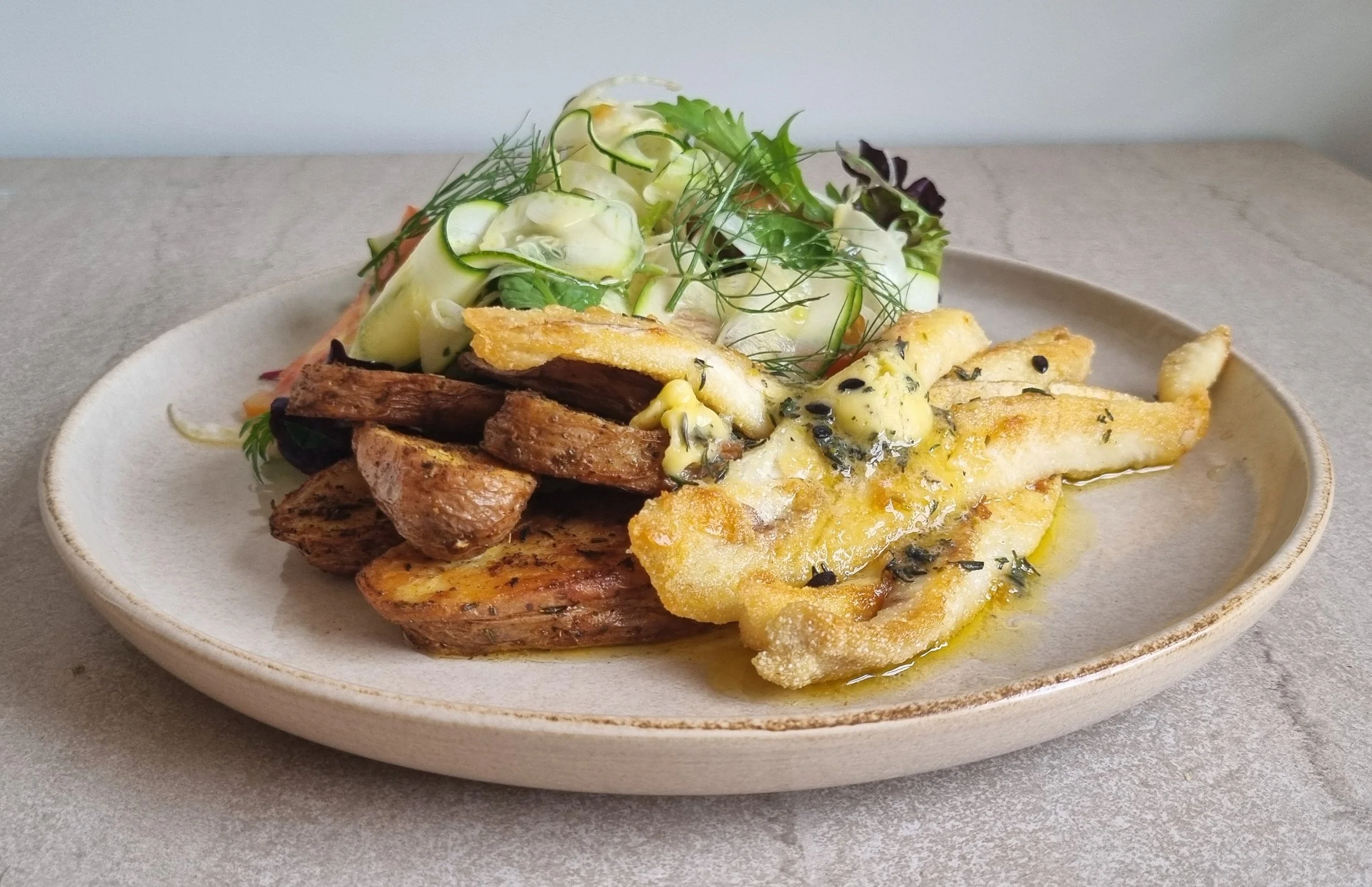 Pan fried flathead with passionfruit butter, roasted potatoes & zucchini salad