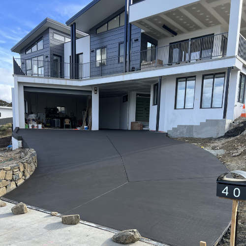 Curved concrete driveway on a rocky, sloped site, Googong - NSW