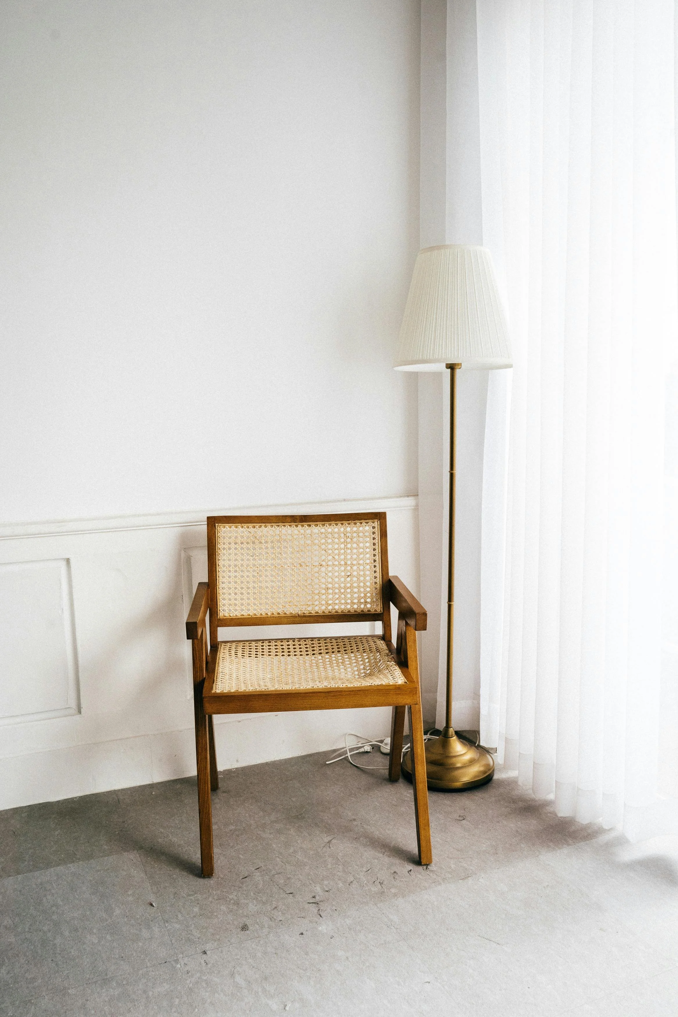 minimal ratten styled chair and lamp