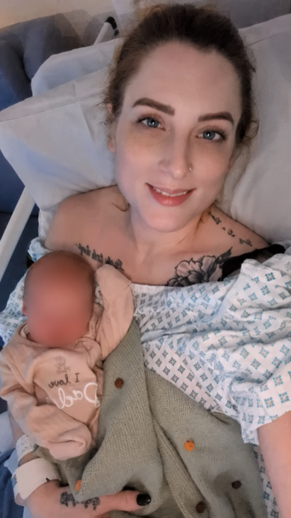 A woman who has just given birth with a newborn baby