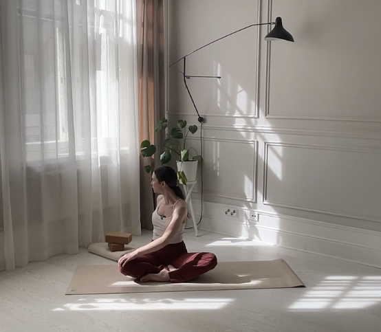 seated twist on floor yoga pose