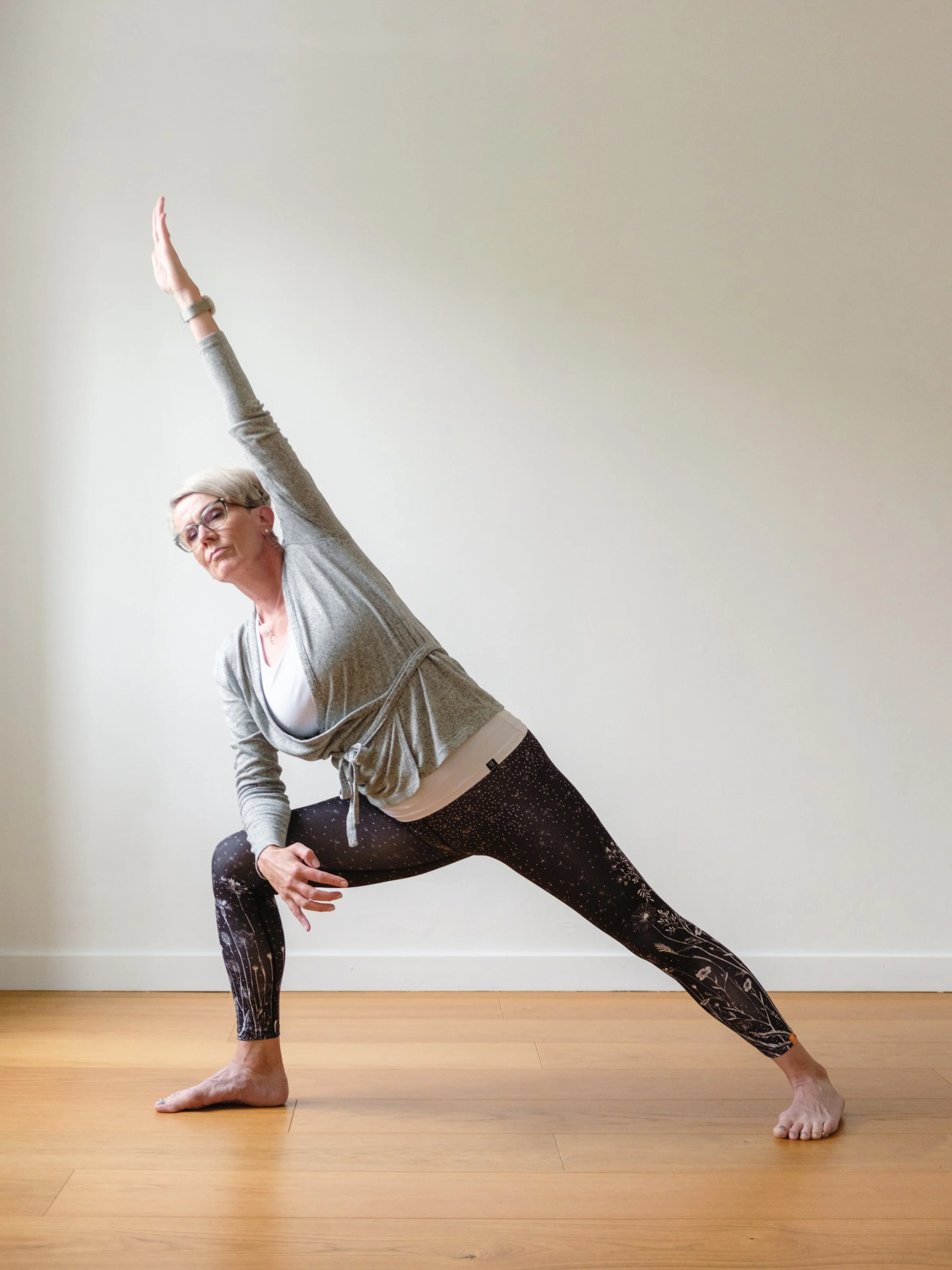 woman doing yoga side angle pose in hämeenlinna