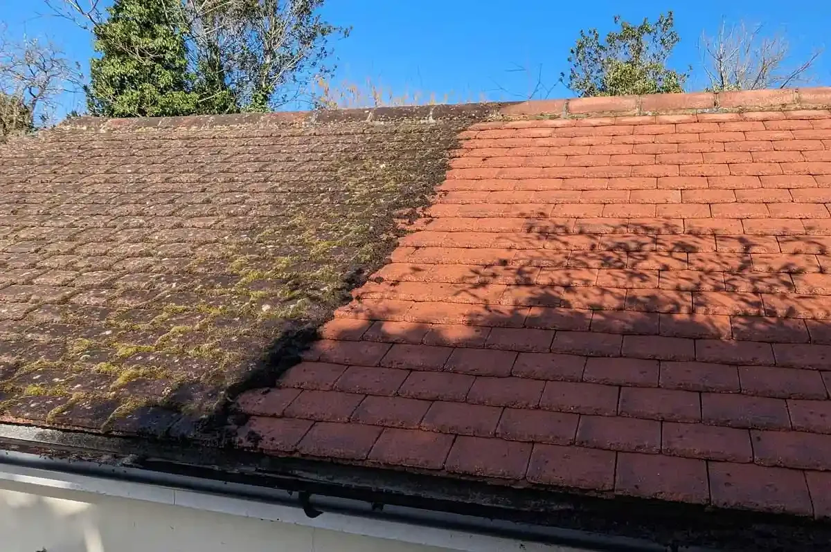 A roof halfway through being cleaned by Brilliant Sheen in Surrey, showing the difference before and after