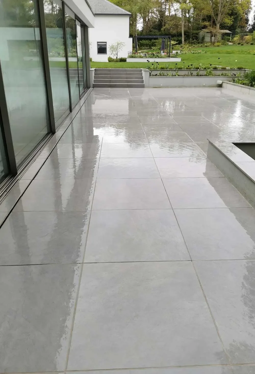 A porcelain paved patio cleaned and restored by Brilliant Sheen in Surrey