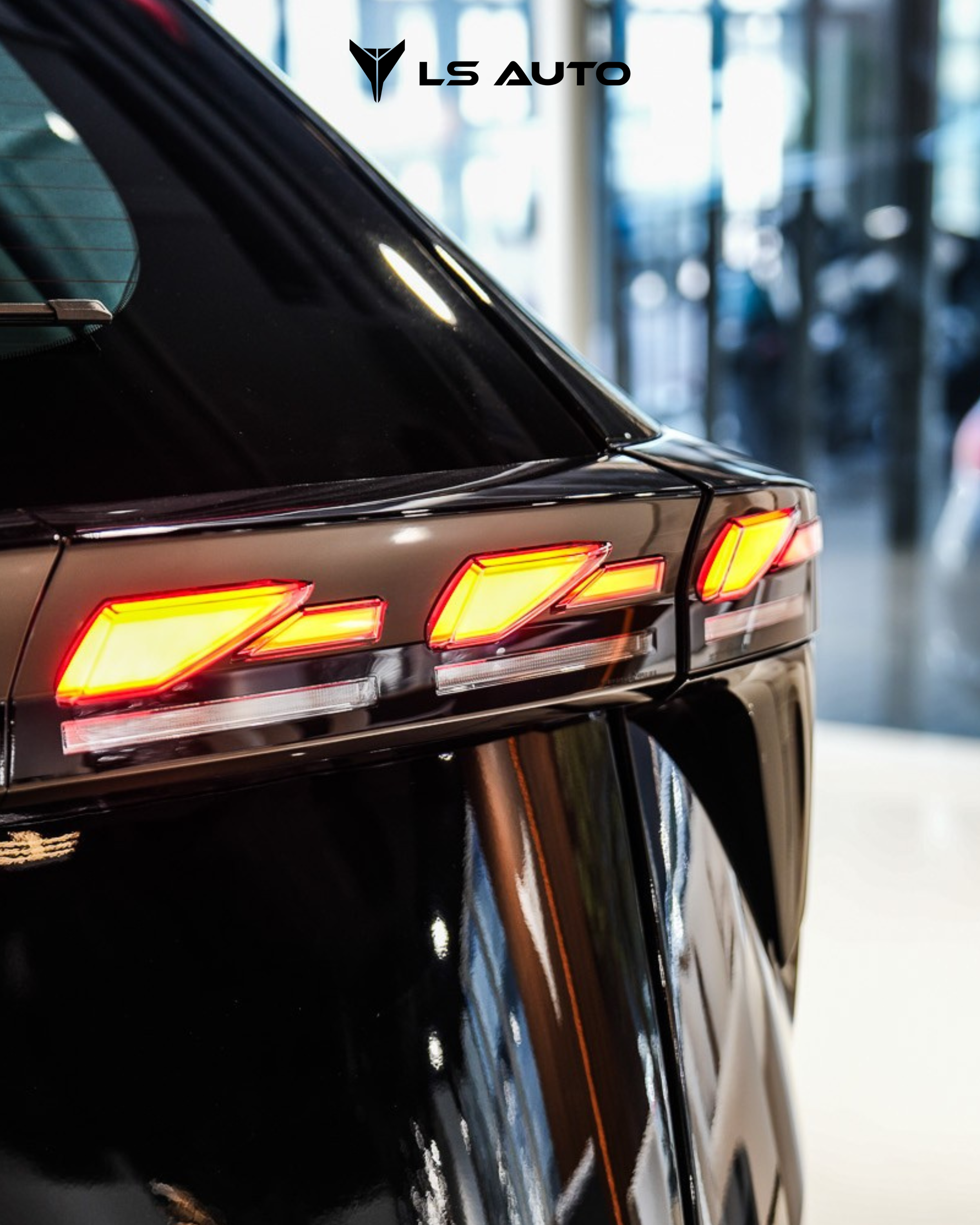 Close-up of the rear left side of the LEV01 showing tail light assembly and part of the rear window, inside the LS Auto UAE car dealership.